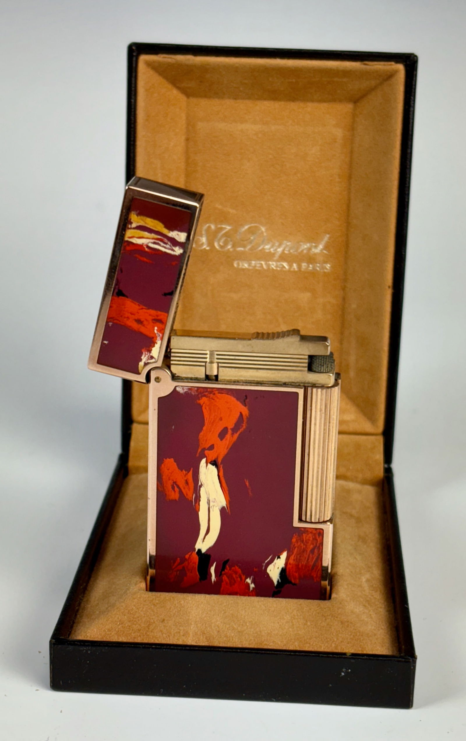 Vintage S.T. Dupont Picasso Model Lighter: Picasso lighter, in fitted box, S T Dupont's first collaborative line, having a china lacquer panel on which Pablo Picasso used as canvases for sketches. Marked "S T Dupont Paris Made in France Laque