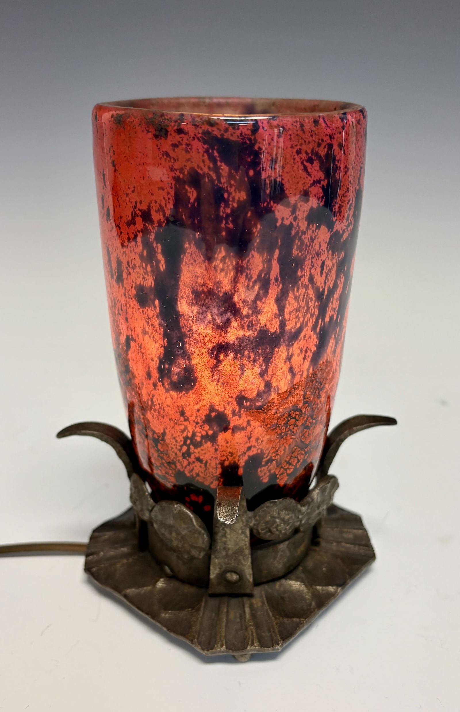 Daum Nancy Art Deco Mottled Glass Boudoir Lamp Sgd: Circa 1910, a signed art deco Daum Nancy lamp of mottled red with splashes of black mounted into fancy iron base, in fine working order, very good condition, 7.25" x 4"