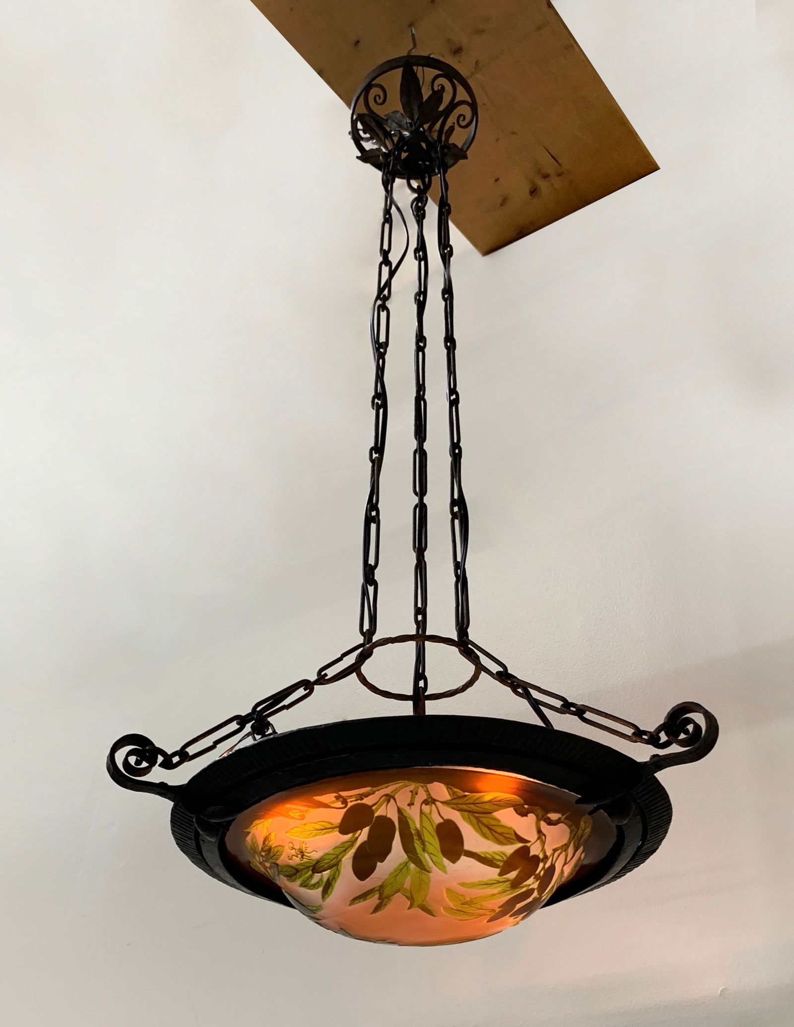 Galle French Cameo Art Glass Chandelier Sgd: Circa 1900, Emile Galle (France 1846-1904) an art nouveau hanging light fixture of cameo glass in earthy green foliage and deep purple olives on a peachy pink ground, with 3 support chains and ceiling