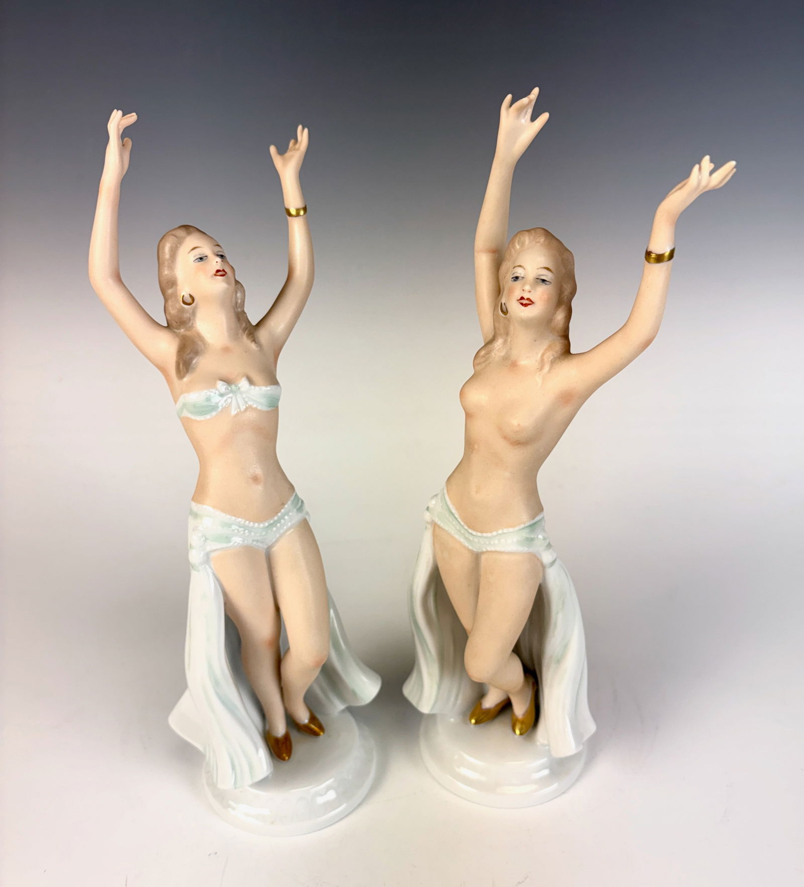 2 Wallendorf Semi Nude Dancers Porcelain Figurines: Two porcelain figures depicting two dancing semi-nude female forms, made by Wallendorf, gracefully modeled with flowing movement and fine detailing. 11” tall × 3.5” wide. In excellent con