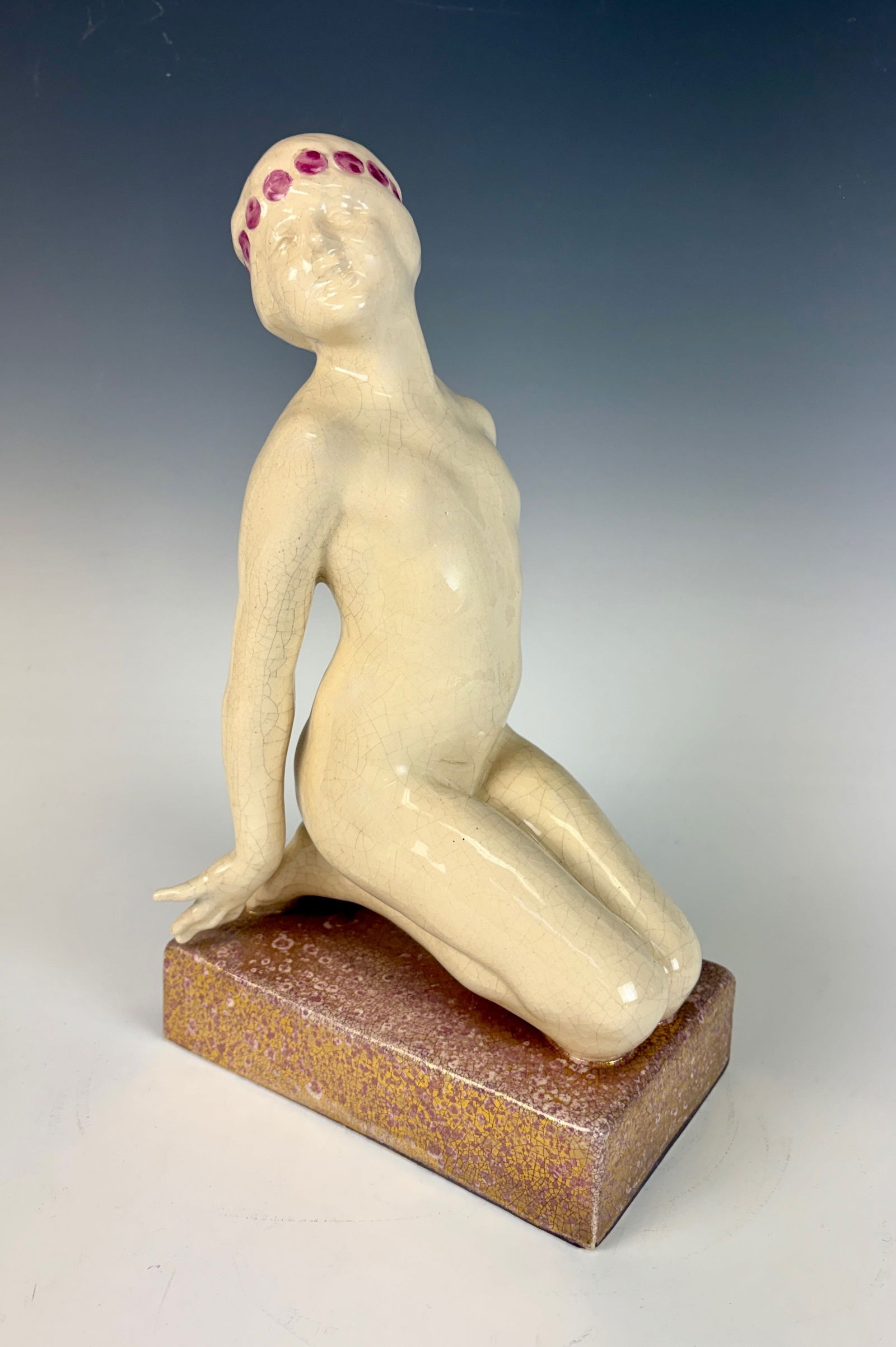 Oscar Zadory Seated Bather Art Deco Figurine: An Art Deco seated lady bather rendered in polychrome crackle-glazed earthenware, signed O. Zadory and C.H. France. This elegant composition reflects the refined stylization and graceful form characte