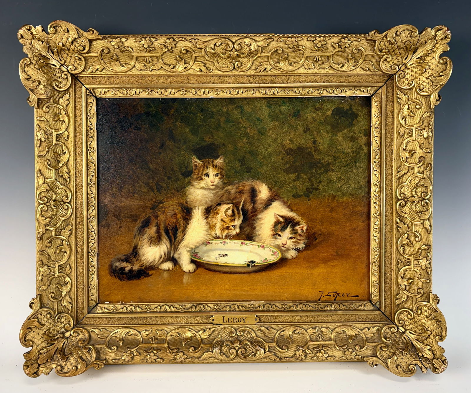 Jules Leroy “Housefly on Plate" Oil Painting: Jules Gustav Leroy (1856–1921) An oil on board by Leroy with three cats focussed on a housefly mounted in its original frame with a brass plaque reading Leroy. Signed lower right, very good conditio