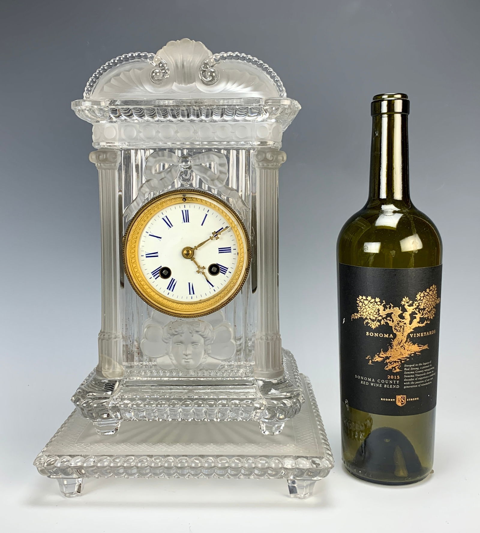 Rare Baccarat Crystal Mantle Clock Signed: Late 19th C, Made in France, a rare frosted and clear crystal clock comprised of four parts with a molded scene of two Jewish men at a table sharing a pitcher having a Star of David while a dog watche