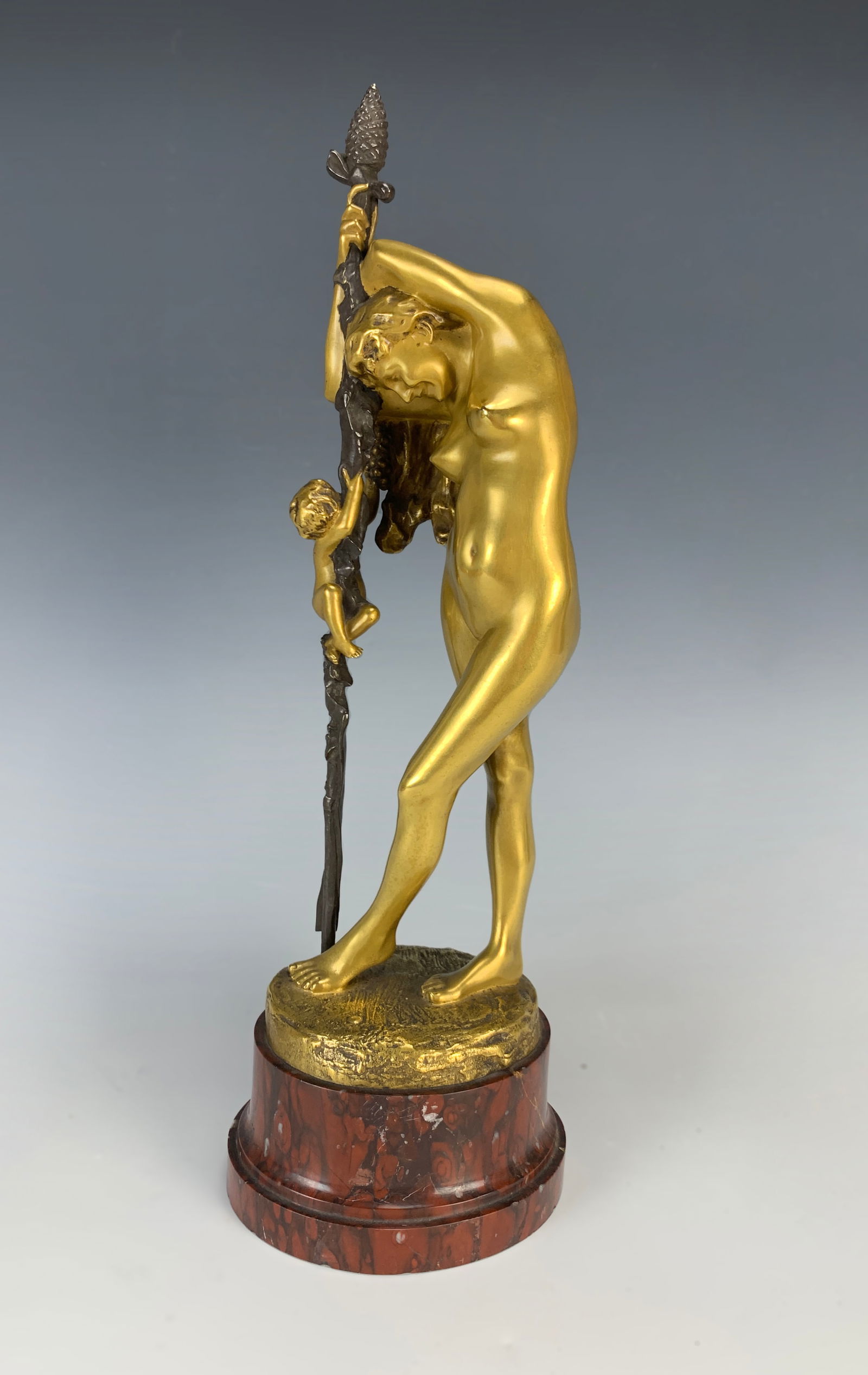 Jean-Leon Gerome "Bacchante w/Grapes" Bronze: Jean-Leon Gerome (1824-1904) Gilt bronze with two patinas depicting a Bacchante with a bunch of grapes, mounted on a rouge marble base. Signed on bronze J.L. Gerome and foundry seal Siot-Decauville