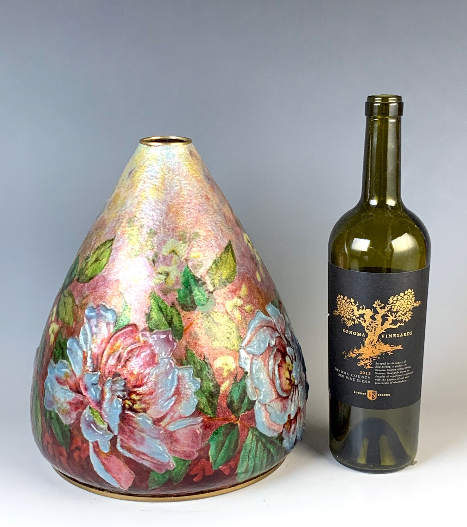 Jules Sarlandie (1874-1936) Art Deco Enamel Vase: Early 20th century. Large vase of enamel over copper with silver foil and decorated with floral decor. Signed "J. Sarlandie, Limoges." Work similar to Camille Faure. Good condition, 10.5"