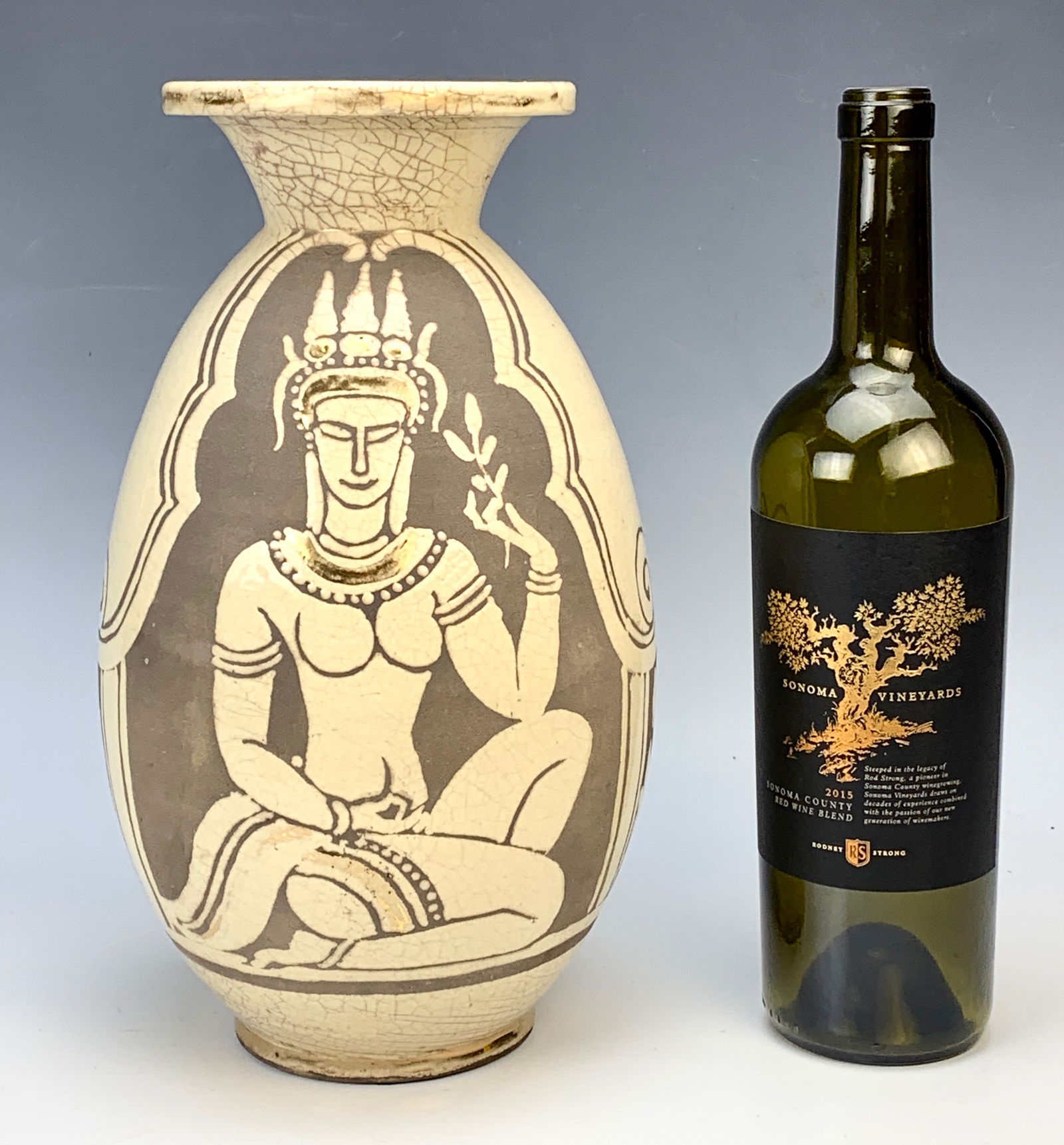 Rene Buthaud Vase with Figures C.1925: Fabulous Rene Buthaud stoneware vase decorated with an Asian figure. Signed "R.B." on underside. Very good condition, Provenance Waddington's, 5/2003 Sold for $3638.00. : 12" tall.