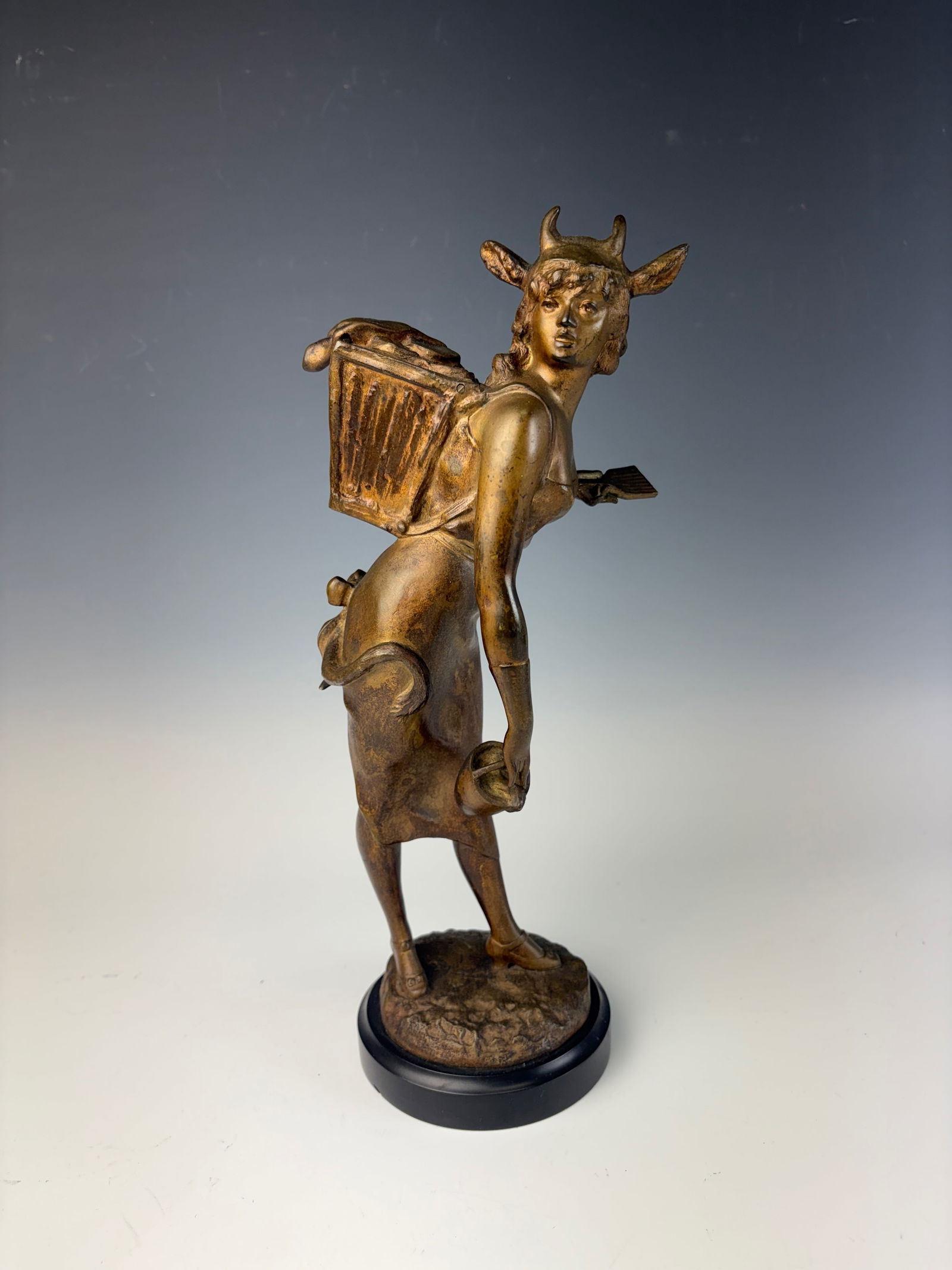 Alfred Grevin Bronze Female Miner: Alfred Grevin (France 1827-1892) Fabulous bronze of a female miner grasping a small shovel in left hand and a bucket in her right hand. She wears a hinged backpack the lid with mining tools. On her