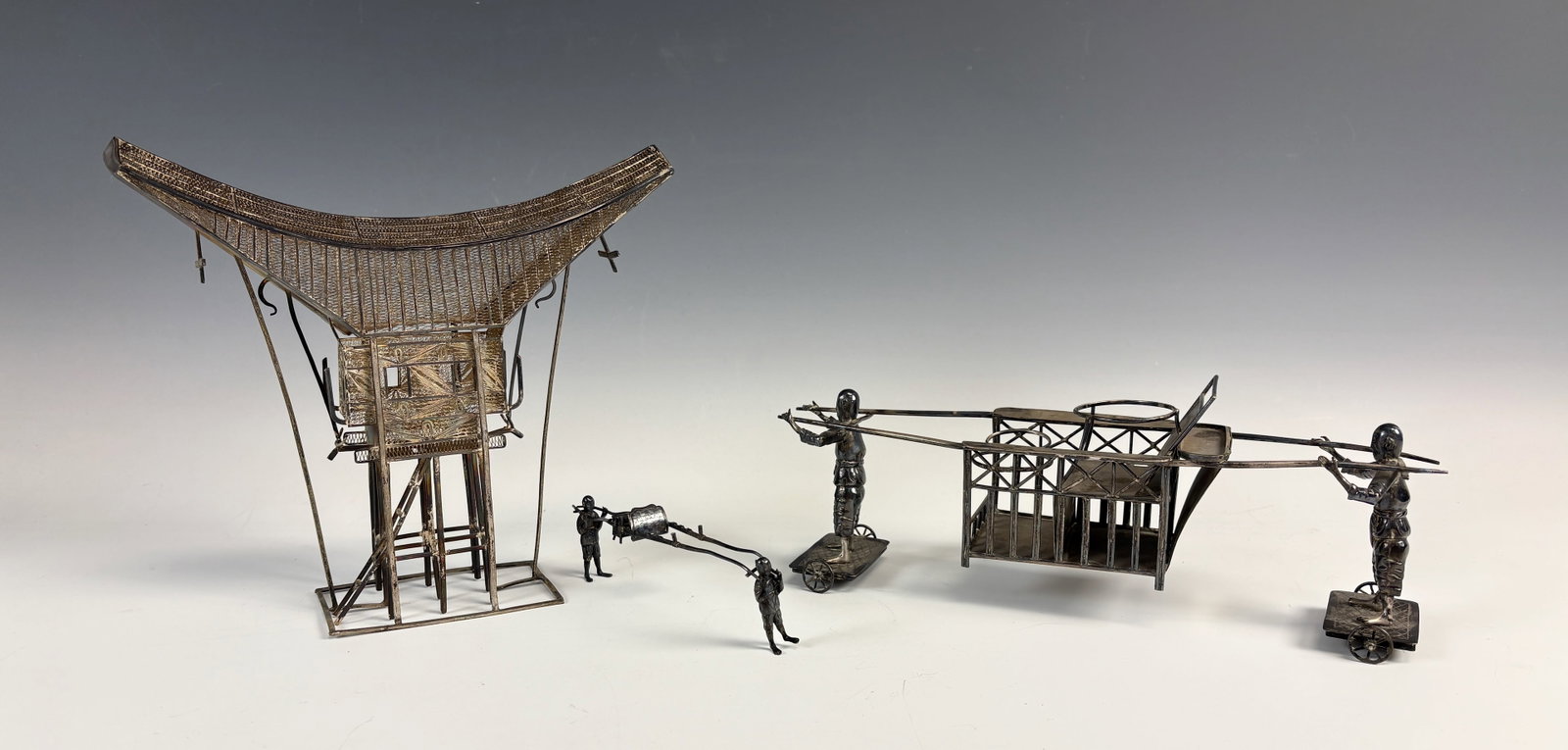 Lot of Japanese Sterling Silver Figural Items: Lot consists of several vintage Japanese silver items, a fine Indonesian Dutch West Indies silver filigree Tongkonan House, a sedan chair, 2 Palanquin bearers, larger bearers without condiment