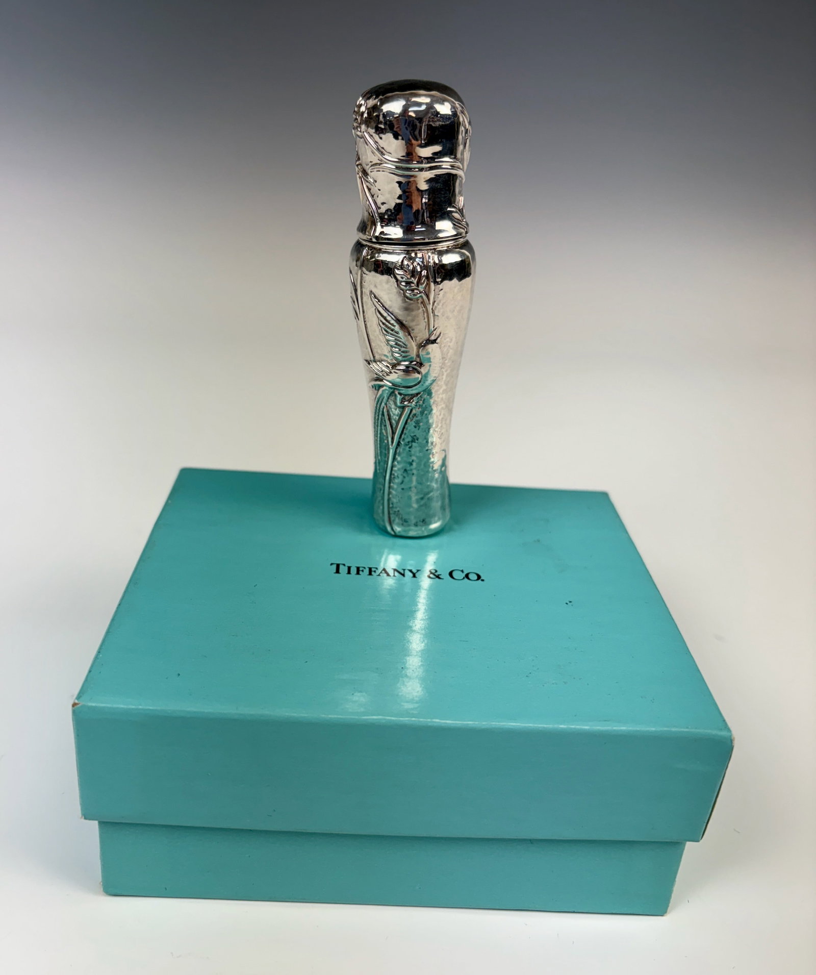 Tiffany & Co Sterling Silver Audubon Perfume: Beautiful sterling silver perfume atomizer hand hammered ground with embossed Japanese bird and bamboo leaf design, marked "Tiffany & Co 925 Spain", with original Tiffany blue box, very good condition