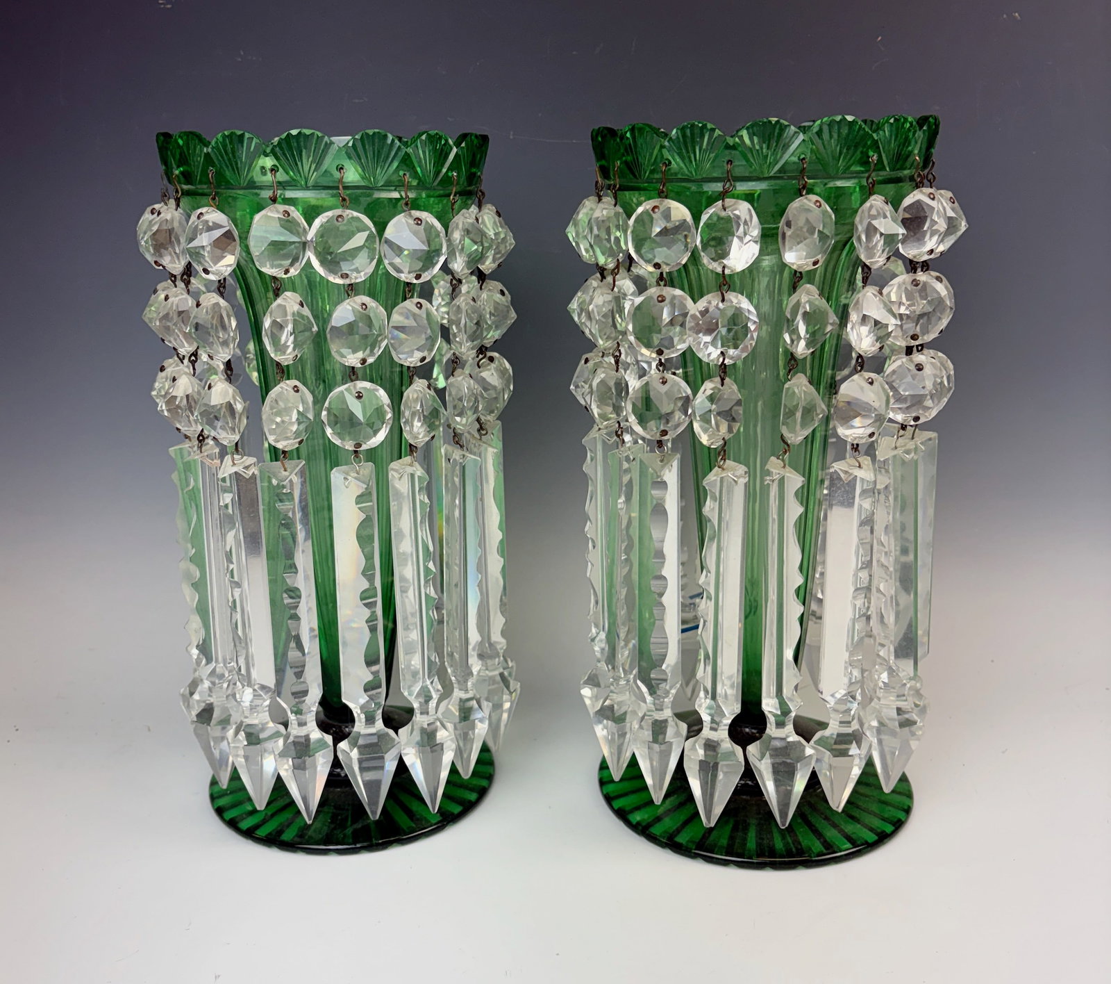 Pair Fine Cut Glass Lustres w Crystal Prisms: Pair beautiful green lustres each with 16 brilliant cut spear prisms, one lustre with cracks that are obscured by the large sparkling prisms, random small chips not noticeable, otherwise good