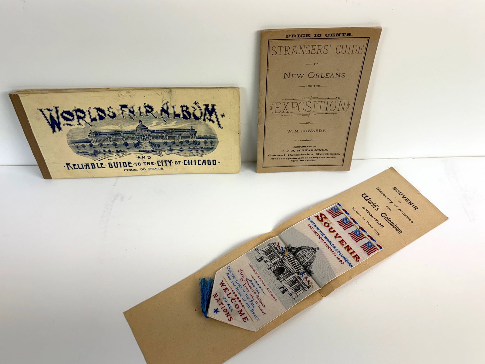 1893 World's Columbian Exposition World's Fair: Great historic Americana, a World's Fair Chicago album and an unused woven scene of The Administration Building on silk souvenir ribbon in pristine condition on original mounting card and reads