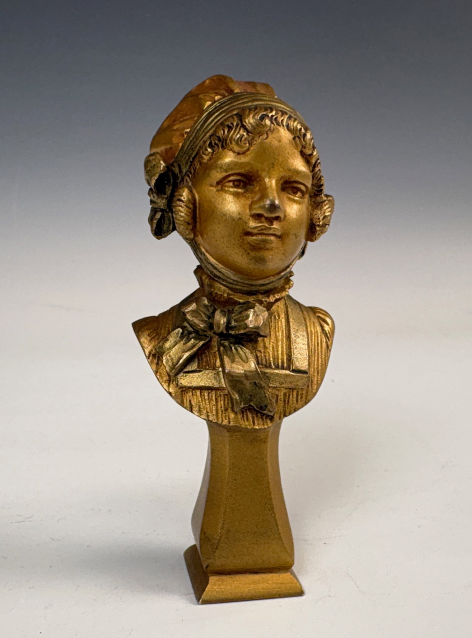 Antique Figural Bronze Letter Seal signed: Circa 1900, nice letter seal modeled as a young girl in a bonnet, mixed shades of patina, signed "A Carton"?, 4" tall, very good condition.Eligible for in-house shipping (U.S. only). Please inquire.