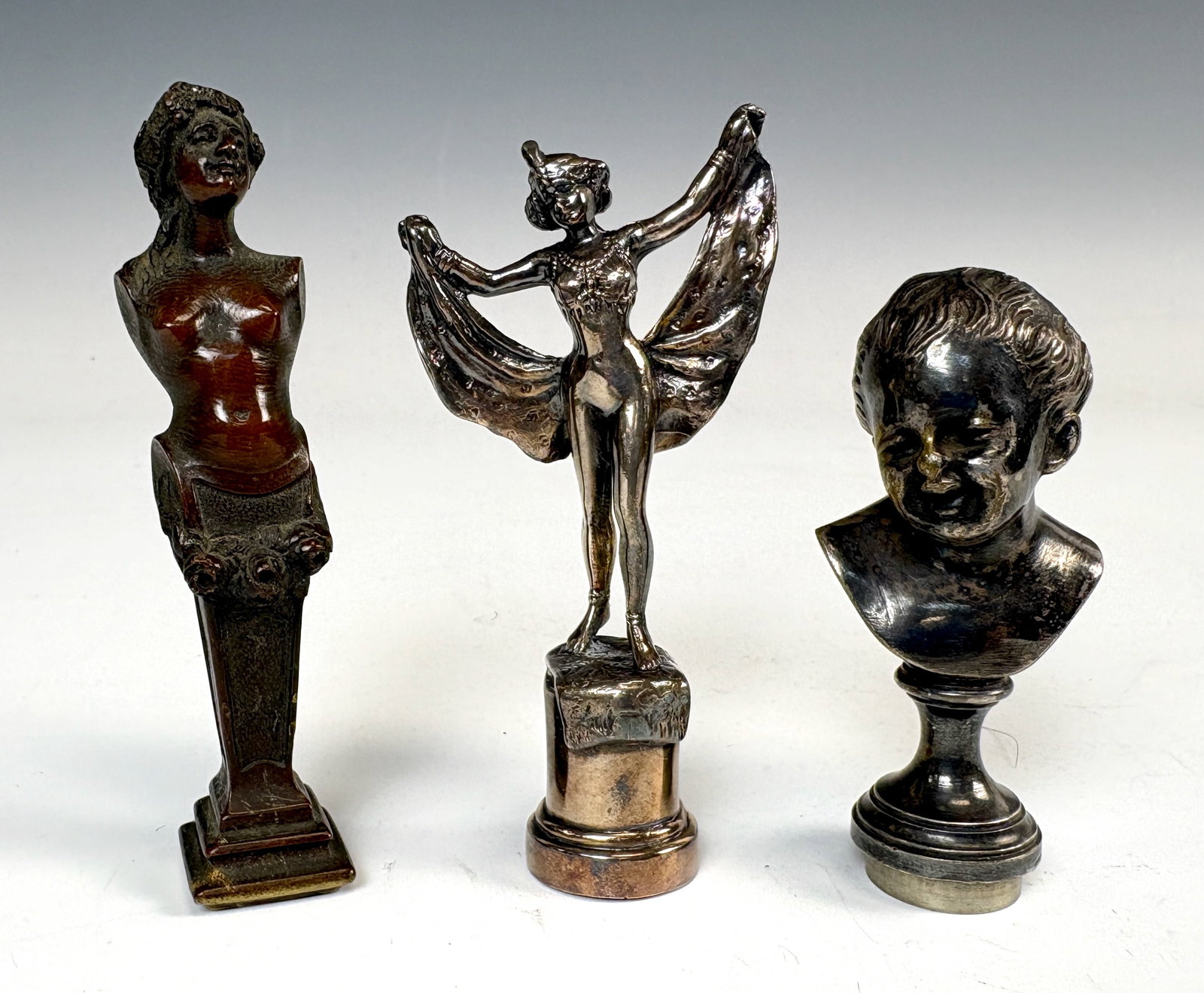 Lot of 3 Antique Bronze Letter Seals: Circa 1900, three antique bronze seals, one a silver over bronze of a flapper dancer, another silver over bronze of a young child and the third in a rich dark bronze patina of a semi nude woman with