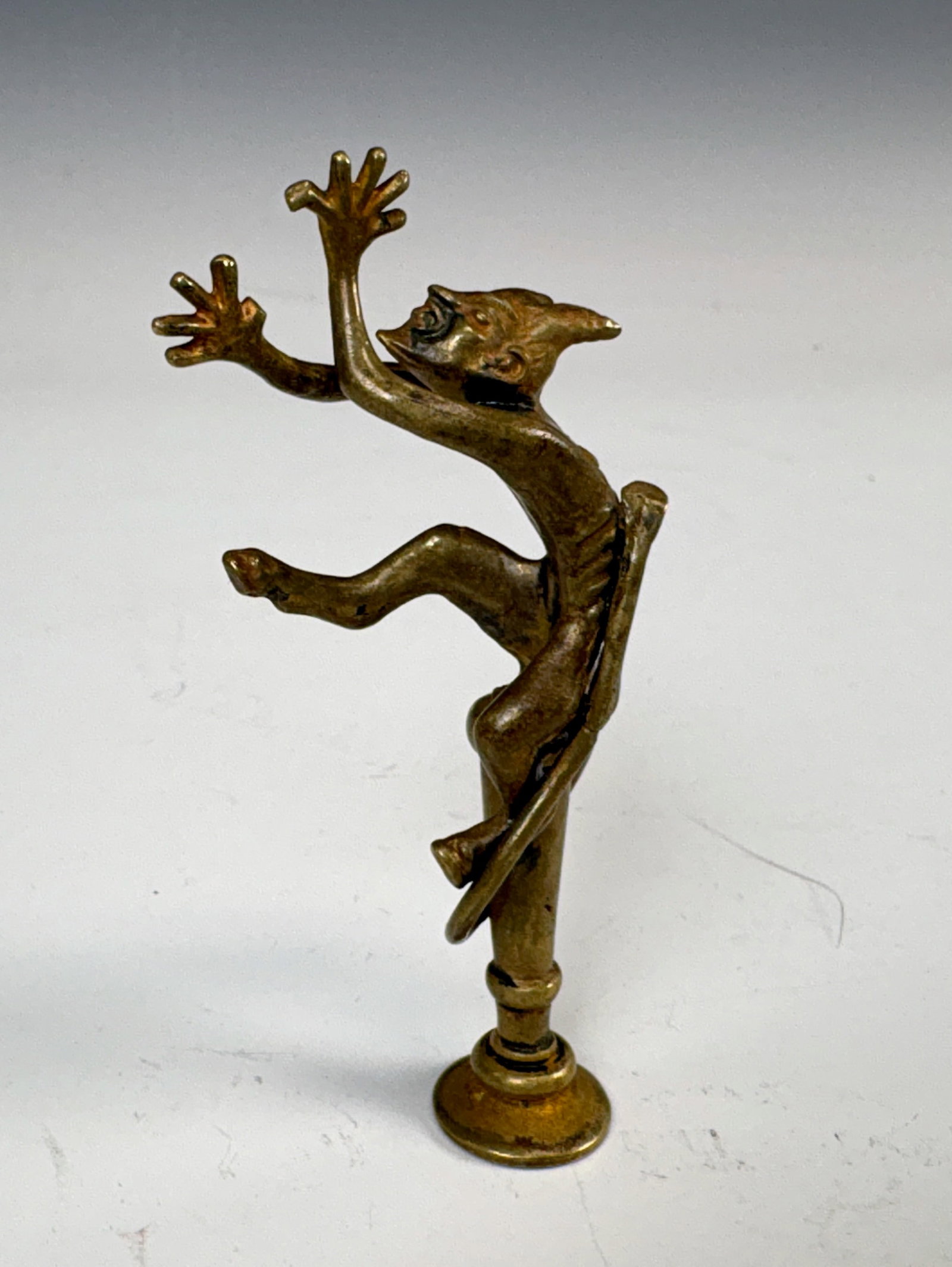 Patinated Antique "Dancing Devil" Bronze Letter Se: Late 19th C. A dancing devil letter seal. 3 1/8" tall. Condition: very good. Provenance: H. Ellis Collection.Eligible for in-house shipping (U.S. only). Please inquire.