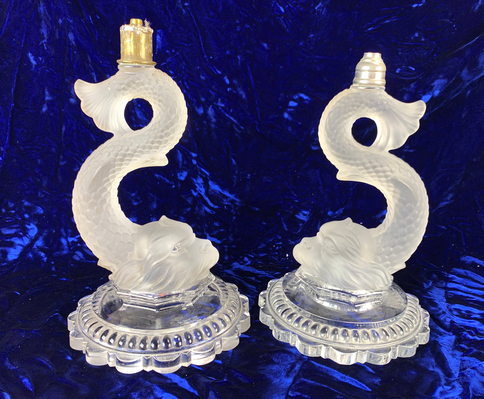 Pair Signed Baccarat Dolphin Lamp Bases: Two individually signed Baccarat dolphin lamp bases, both the same design, and one is slightly taller than the other. One is signed with the Baccarat logo, and the other is embossed "Baccarat" and