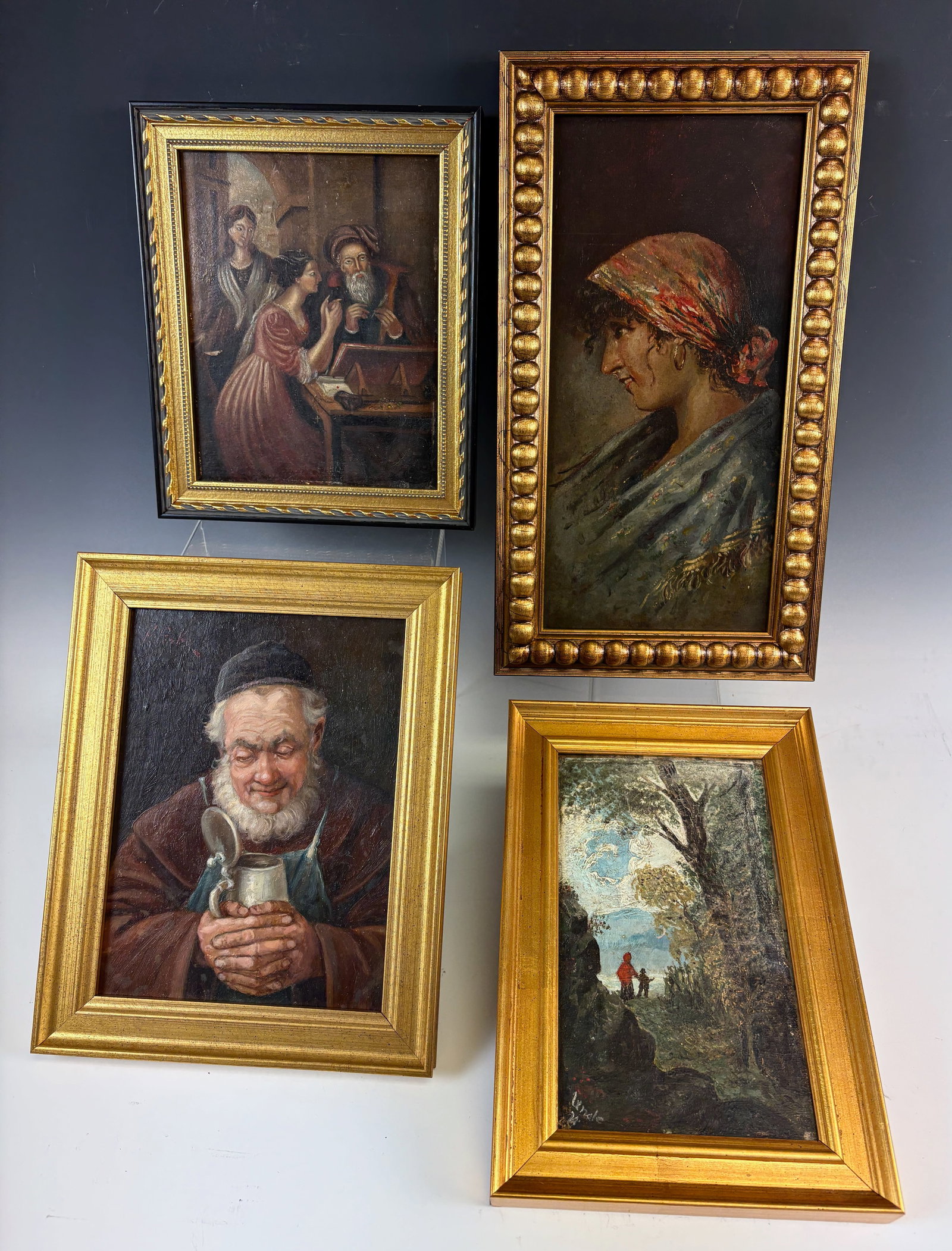 Group of 4 Antique Oil Paintings: Nice lot consists of four antique oil paintings a portraid of a woman with scarf, a monk, two people in the forest and 2 ladies and the philosopher, all in good condition, 12.5" x 6" largest.Eligible