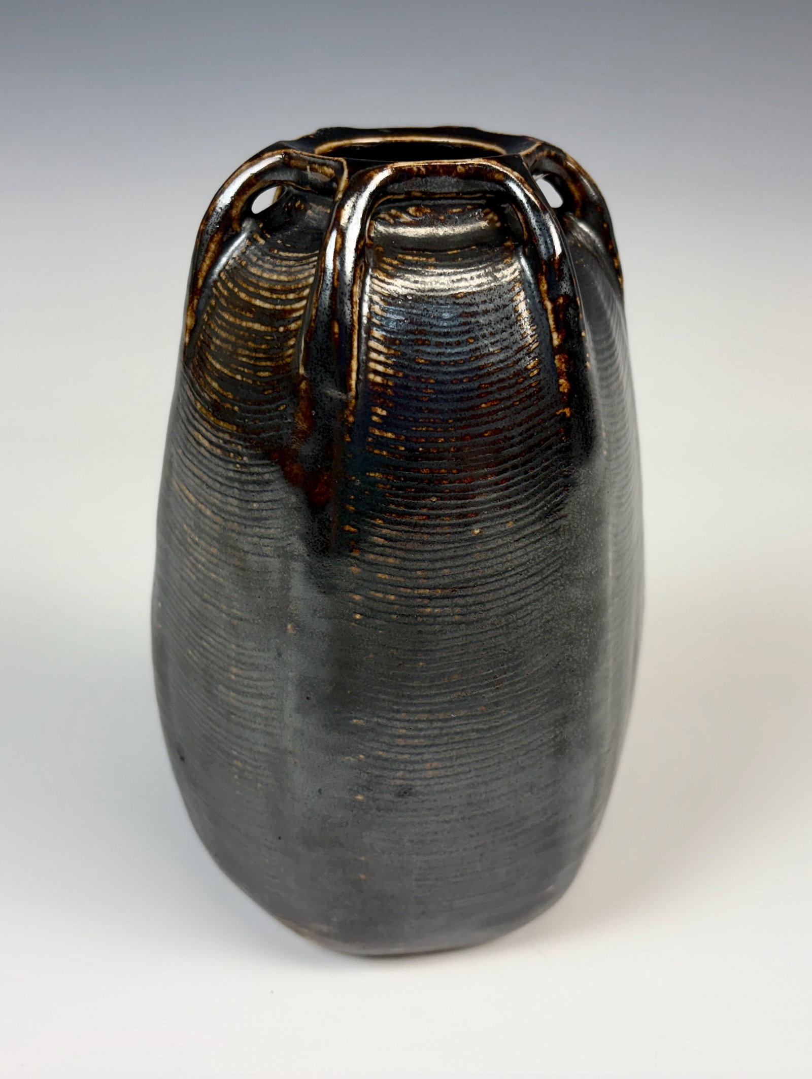Signed & Numbered Martin Brothers Vase: Martin Brothers vase 10-1913, a hexagonal shape with horizontal ribs in dark brown iridescent glaze, with six applied arms at rim, signed "Martin Brothers London & Southall 10-1913", very good conditi