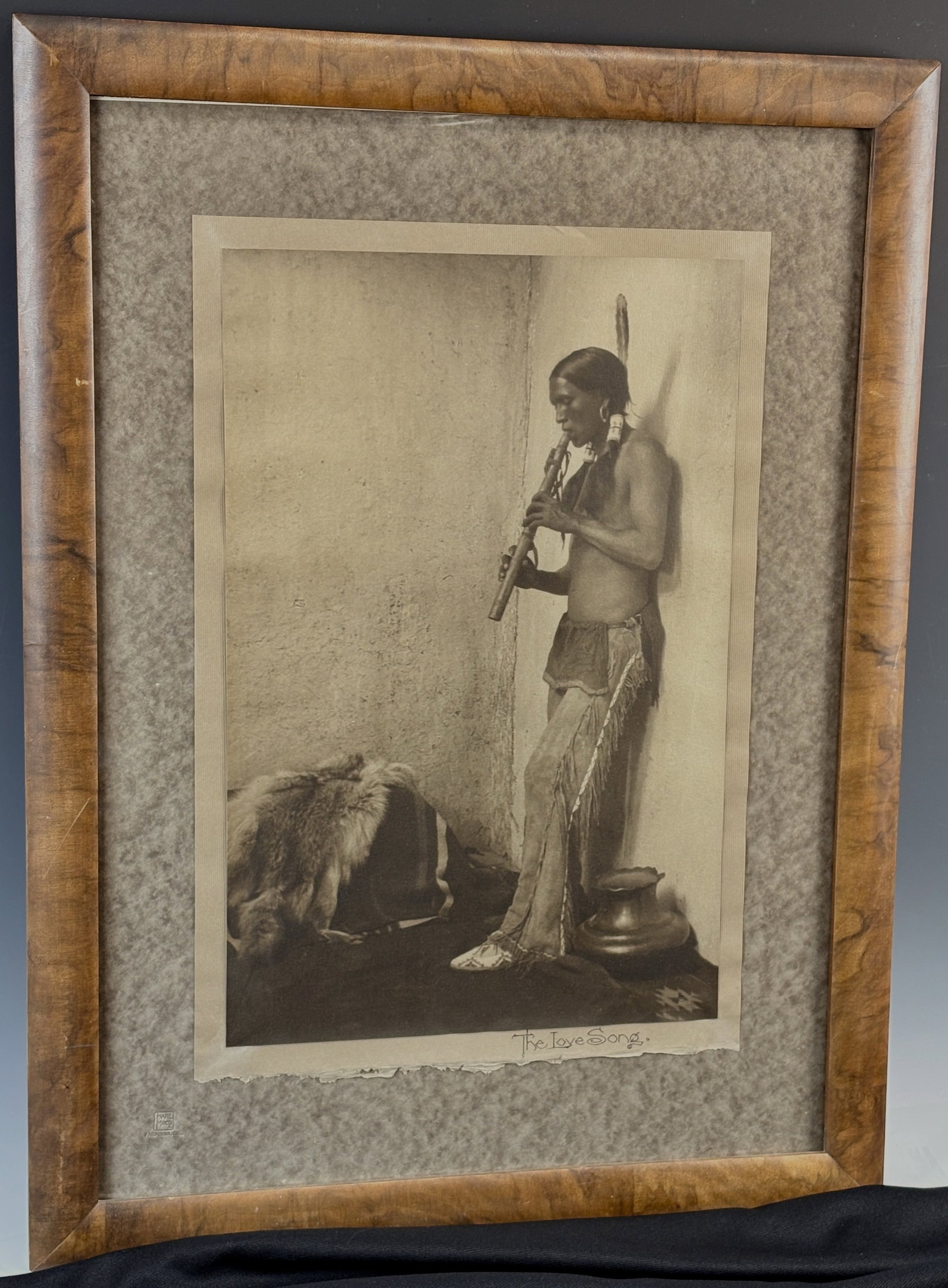 Carl (Karl) Moon Photograph "The Love Song": Carl (Karl) Moon (1879-1948) Gelatin silver photo of a standing man playing a flute, stamped lower left with Karl Moon Studio stamp and Pasadena CA, also marked in ink on bottom of photo "The Love