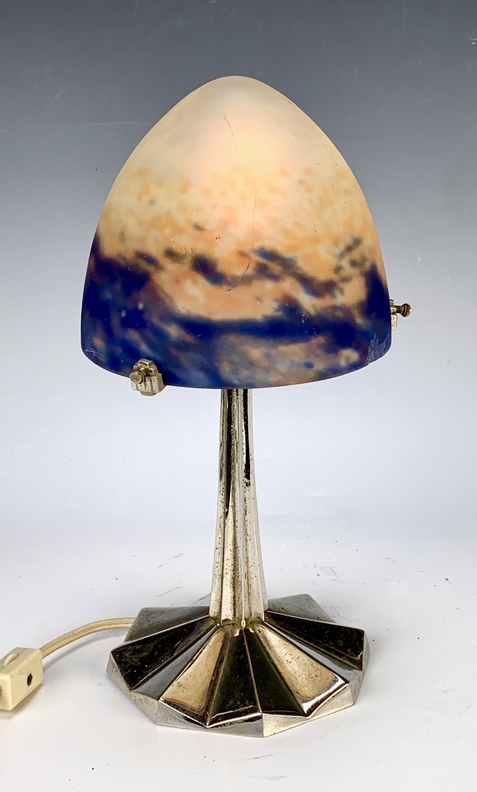 Muller Fres Luneville Art Deco Boudoir Lamp: Circa 1920, mottled blue amber and white frosted glass dome shade signed "Muller Fres Luneville", mounted on a faceted silver over bronze deco base and supported by 3 arms, 10.75" (28cm) tall, shade 5