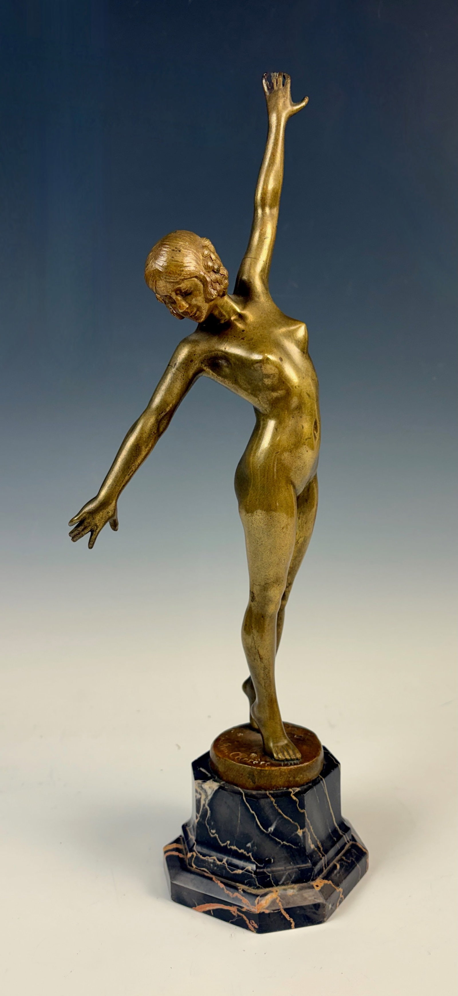 Fernand Ouillon-Carrere Bronze Nude Dancer: Fernand Ouillon-Carrere (1879-1959) Dated 1919, bronze sculpture of a nude dancer, signed on base "F. Ouillon-Carrere", figure mounted upon octagonal black marble base with yellow and white veining, g