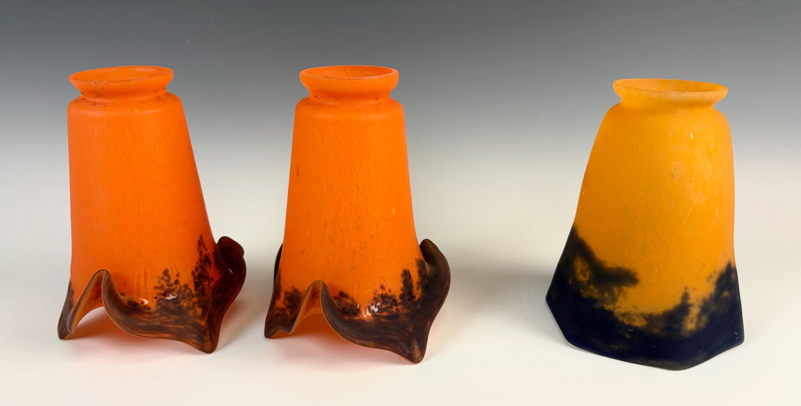 Lot of 3 Art Glass Shades, 2 Marchand, 1 Degue: Three signed French art deco art glass shades,, 2 are a matched pair mottled orange, signed Marchand, the single is signed Degue, all in very good condition, the pair are 6" tall with 2" fitters, the