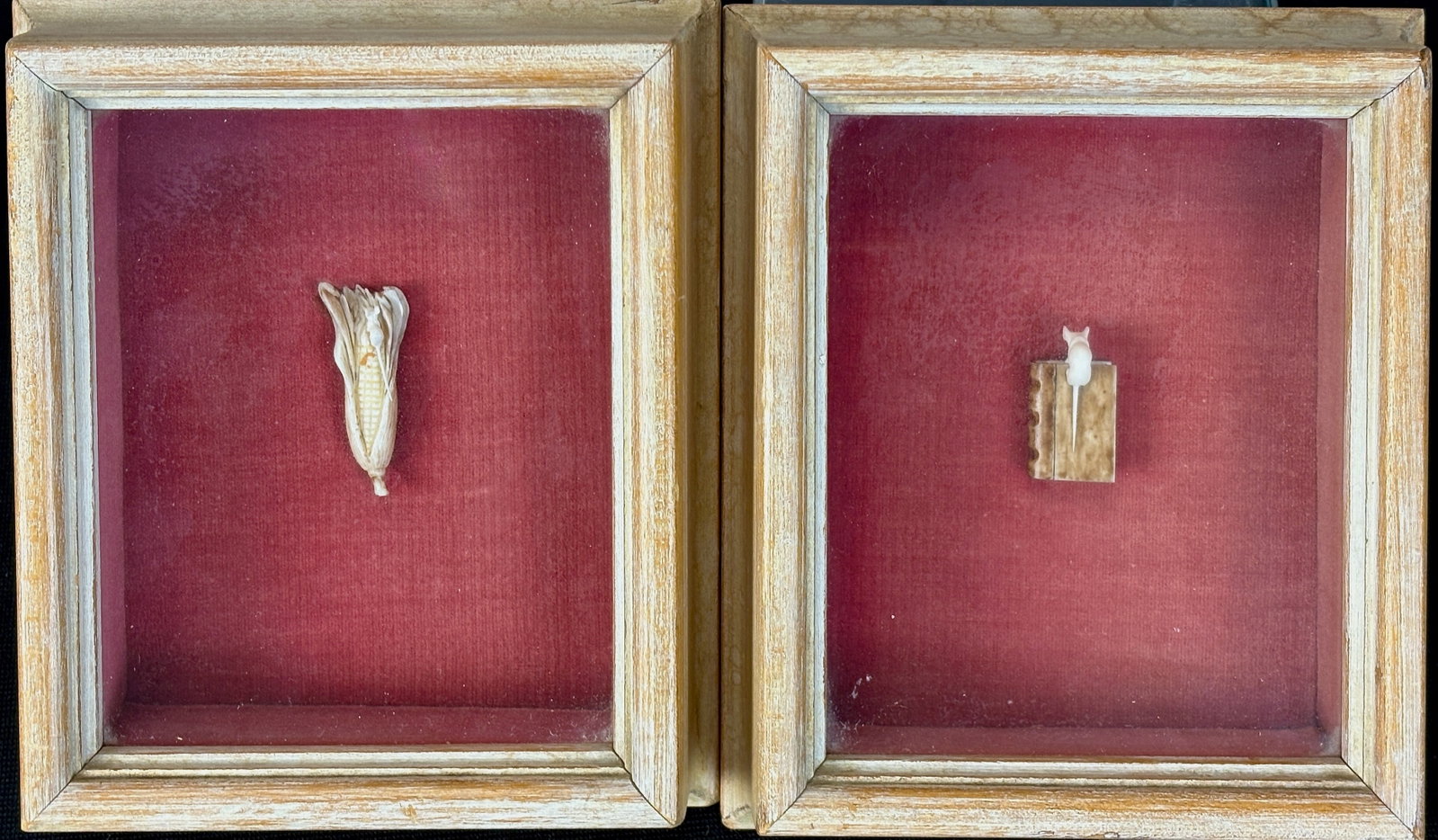 Pair Miniature Carved Mice in Shadow Boxes: Circa 1920, unique pair of finely carved miniatures in shadowboxes, one of a mouse atop a closed book and the other of a mouse climbing an ear of corn, each in shadow box frame with red interior, actu