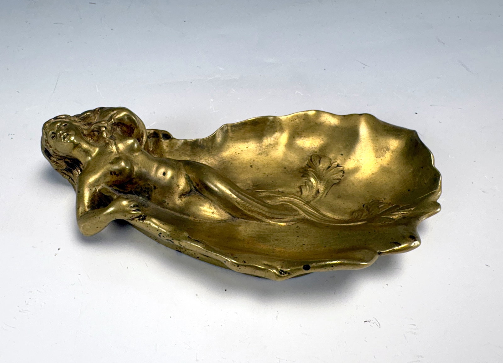 Bronze Nude Mermaid Figural Dish sgd Bauer: Circa 1920, a gilt bronze dish with a reclining nude mermaid, signed Bauer along the side, 6.5" x 4", good condition