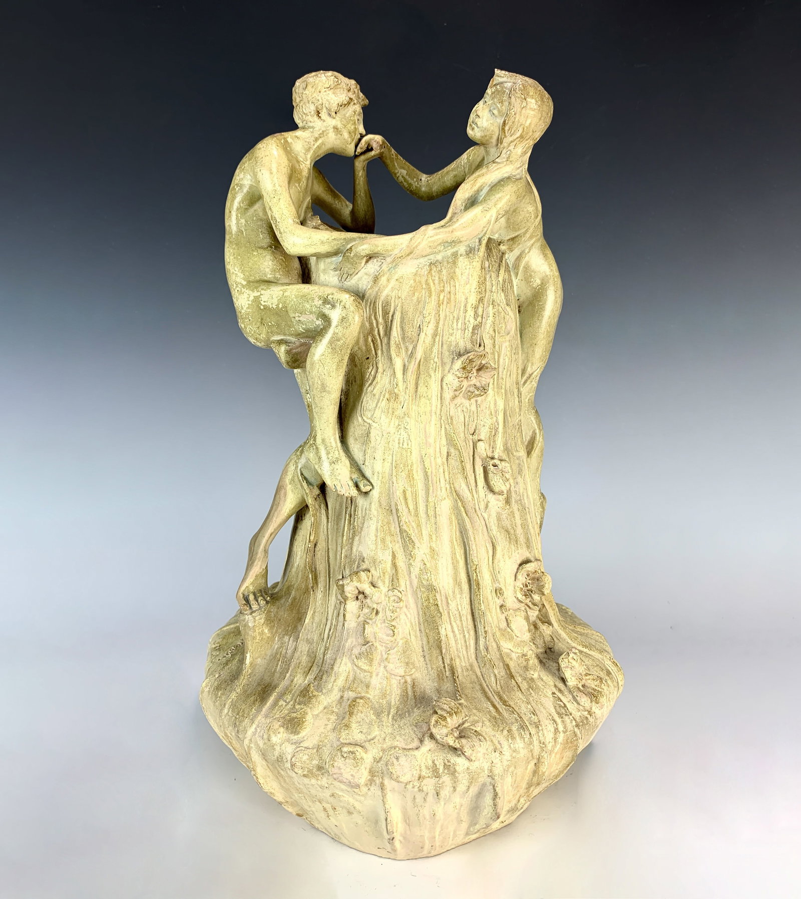Goldscheider Terracotta Art Nouveau Figural Vase: Circa 1890. With two nude lovers entwined at top of vase while climbing up a floral and leaves mound. Signed on side "Pecheur", a known decorator at Goldscheider , Marked 0835, 37&35. broken thumb, no
