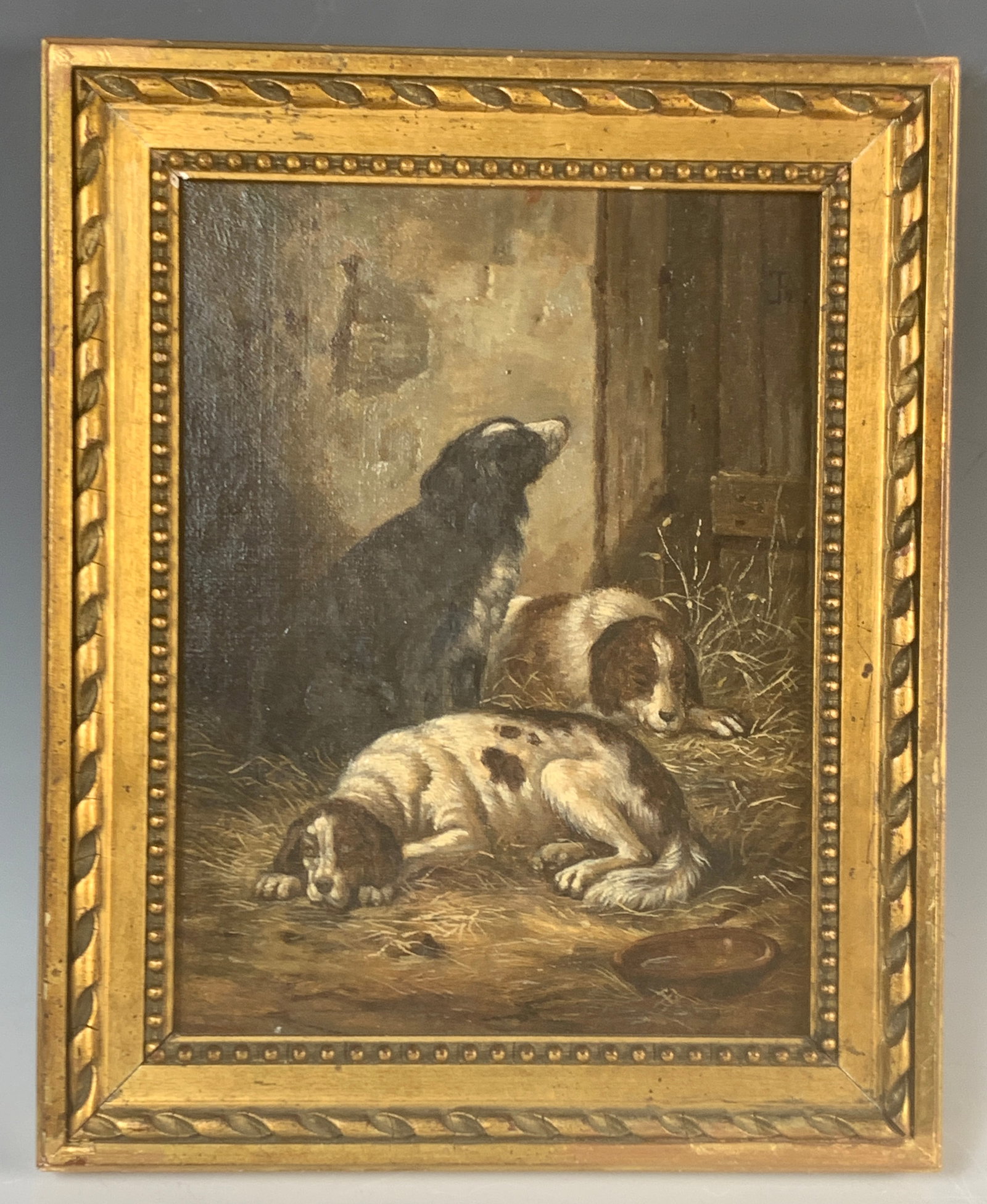 Antique Painting "Three Dogs In Barn": Circa 1900, Oil on board. Charming painting of three dogs in a barn. Has the monogram JR. Mounted in a gilt frame, good condition, sight 9" x 7", framed 11.5" x 9.25"