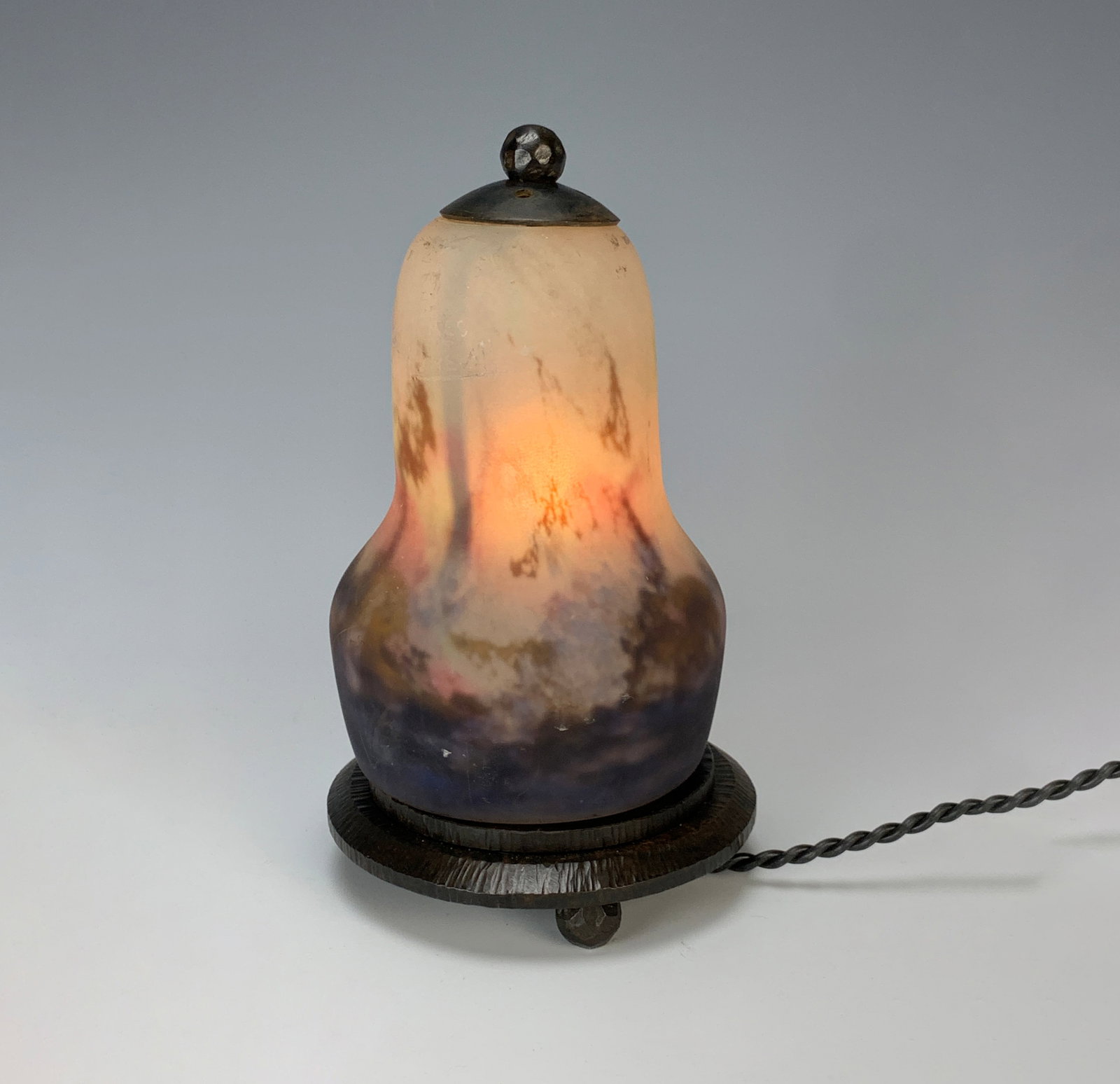 Muller Freres Art Glass Luneville Veilleuse: Circa 1920,art deco night light with bell shaped art glass shade of mottled white and blue frosted glass signed "Muller Freres Luneville" on wrought iron fitted base, in working order, we always advis
