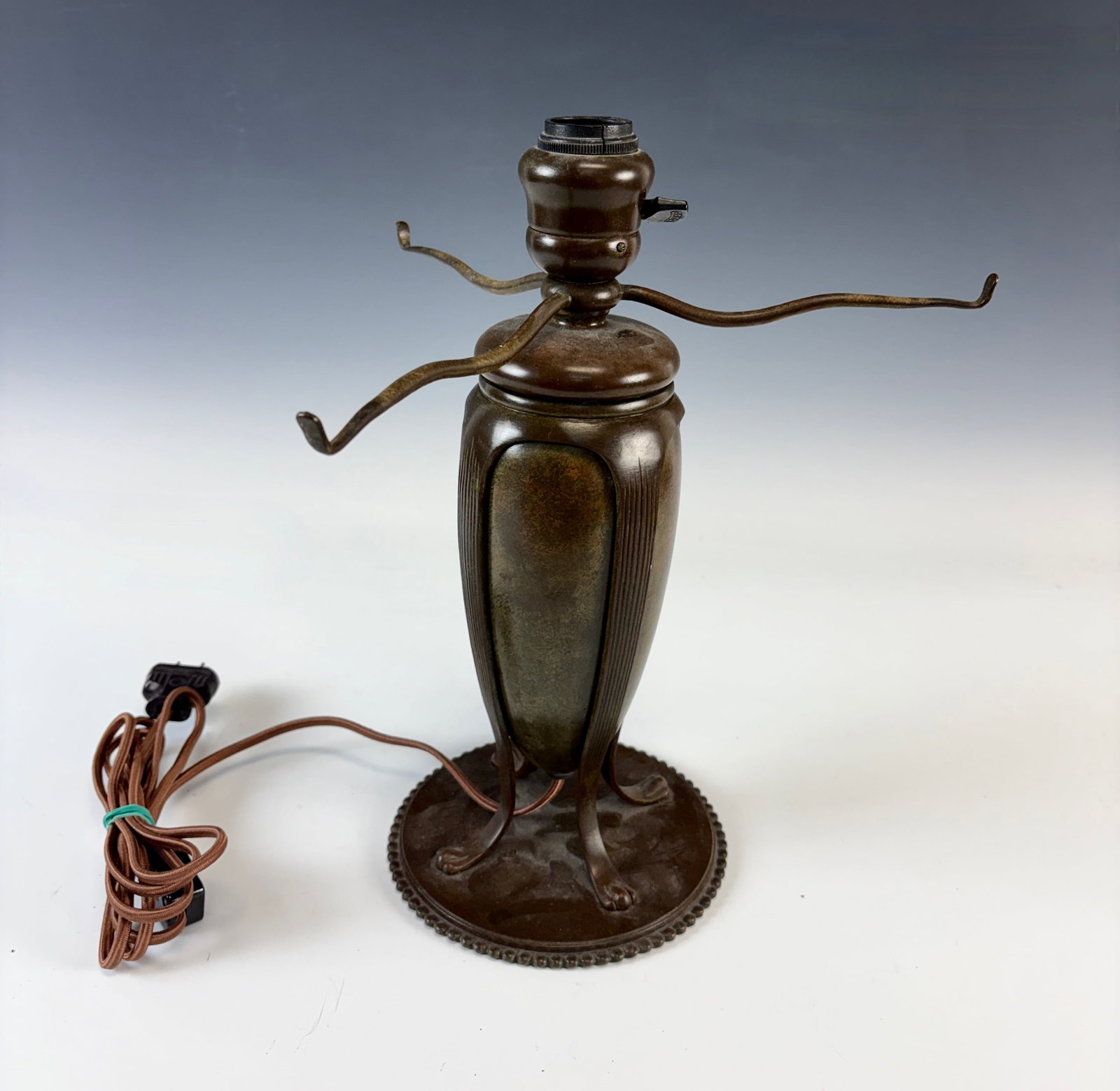 Tiffany Studios Table Lamp Base: Good Tiffany Studios bronze lampbase, original patina, 3 shade support arms, takes 12 inch shade, signed "Tiffany Studios, New York #5, 25901" and early logo "TGD.Co" (Tiffany Glass & Decorating), has