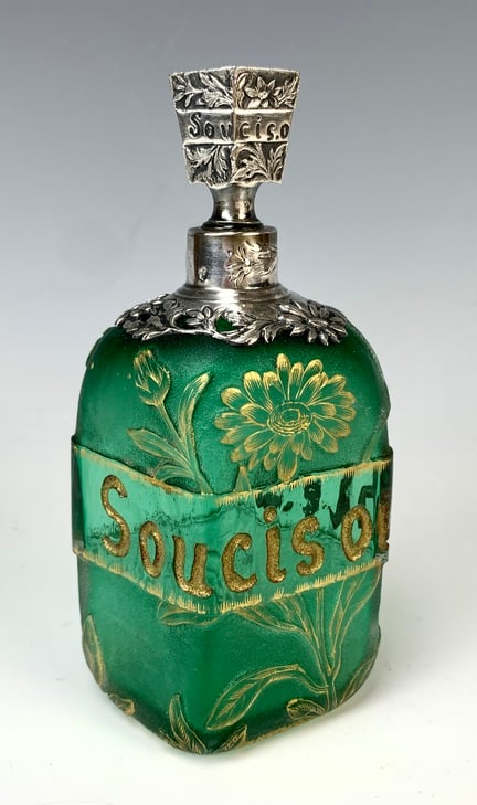 Daum Nancy Cameo Glass & Sterling Perfume Bottle: Circa 1900, frosted green glass vase, acid-etched with chrysanthemums and French "soucis oublie," meaning "forget your troubles" and gilt accents, gilt "950" silver collar and stopper in art nouveau t