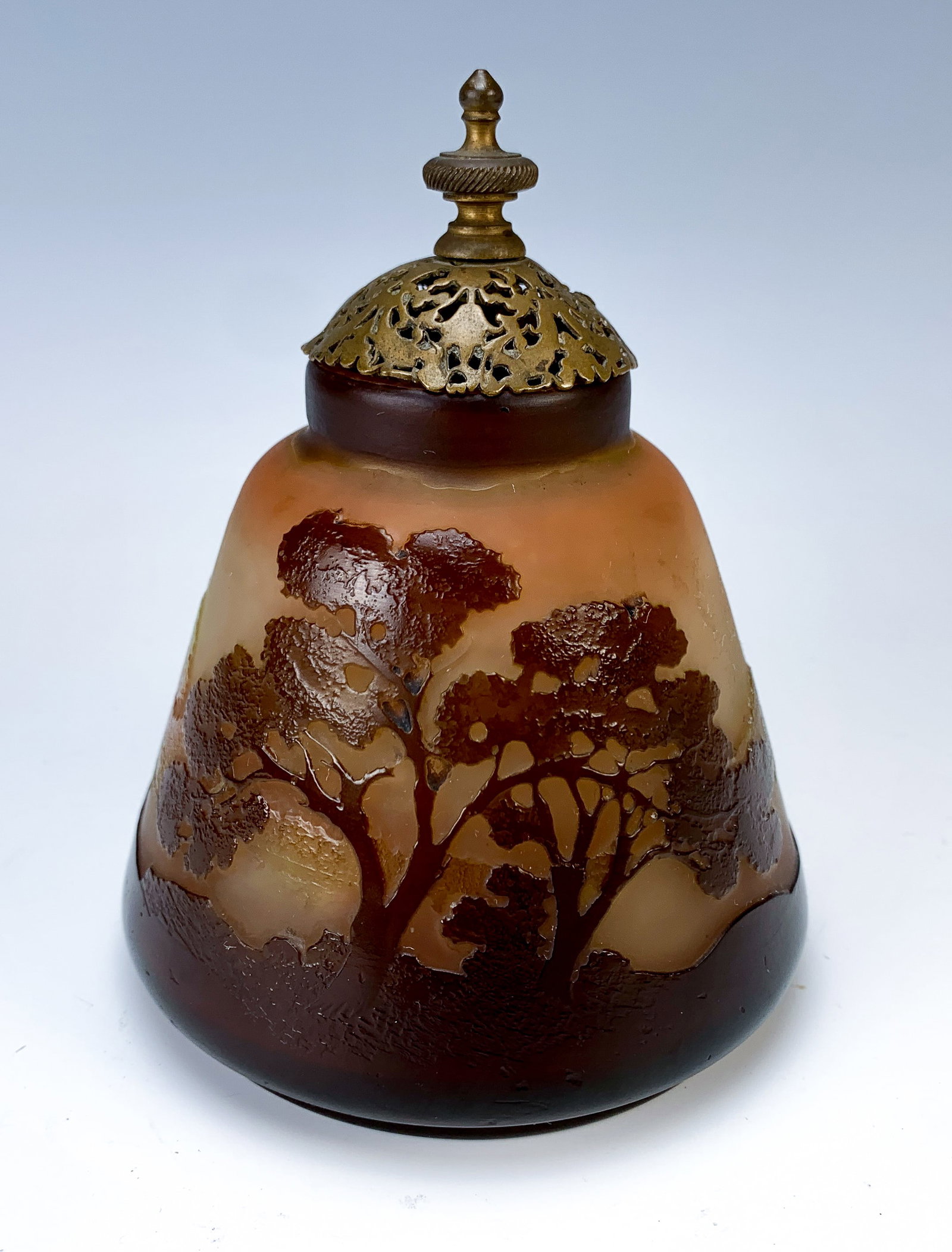 Signed Galle Rare Scenic Veilleuse (Night Light): Circa 1900, scenic multi-layered cameo glass nightlight having a landscape in violet and green on satin beige and orange background, engraved signature "Galle", topped with fancy-cut bronze lid , very