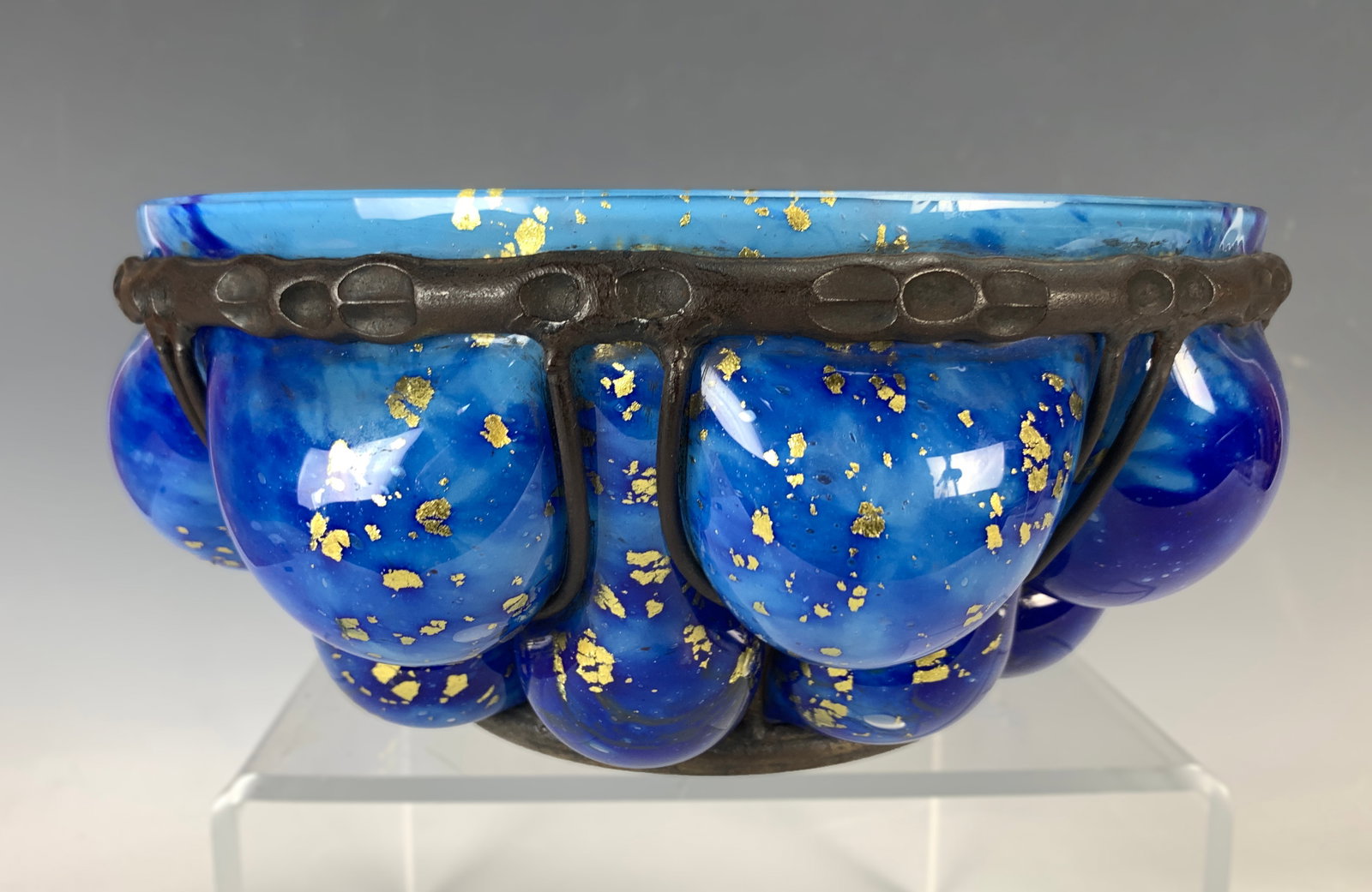 Daum Nancy & Majorelle Blue Blowout Bowl w Foil: Circa 1925. fine Daum cornflower blue glass bowl with gold foil inclusions blown into Majorelle wrought iron frame, signed on the bottom Daum Nancy and Majorelle, very good condition, 10" diameter x 5
