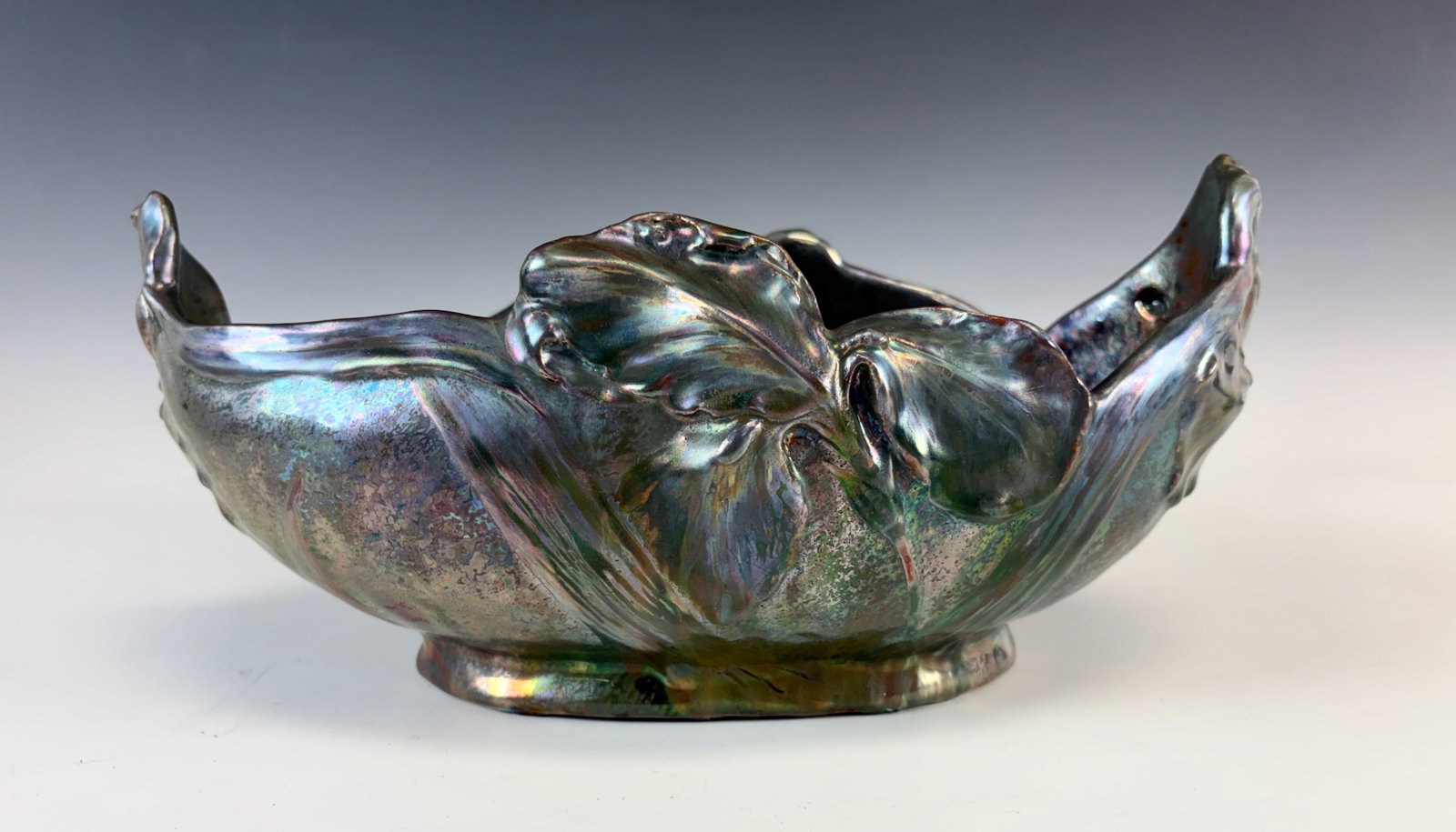 Clement Massier Iridescent Bowl: Clement Massier (1844-1917) A very nice earthenware oblong bowl decorated with irises with red, violet and gold metallic lustre. signed "M. Clement Massier Golfe Juan, AM". The uncommon M in his signa