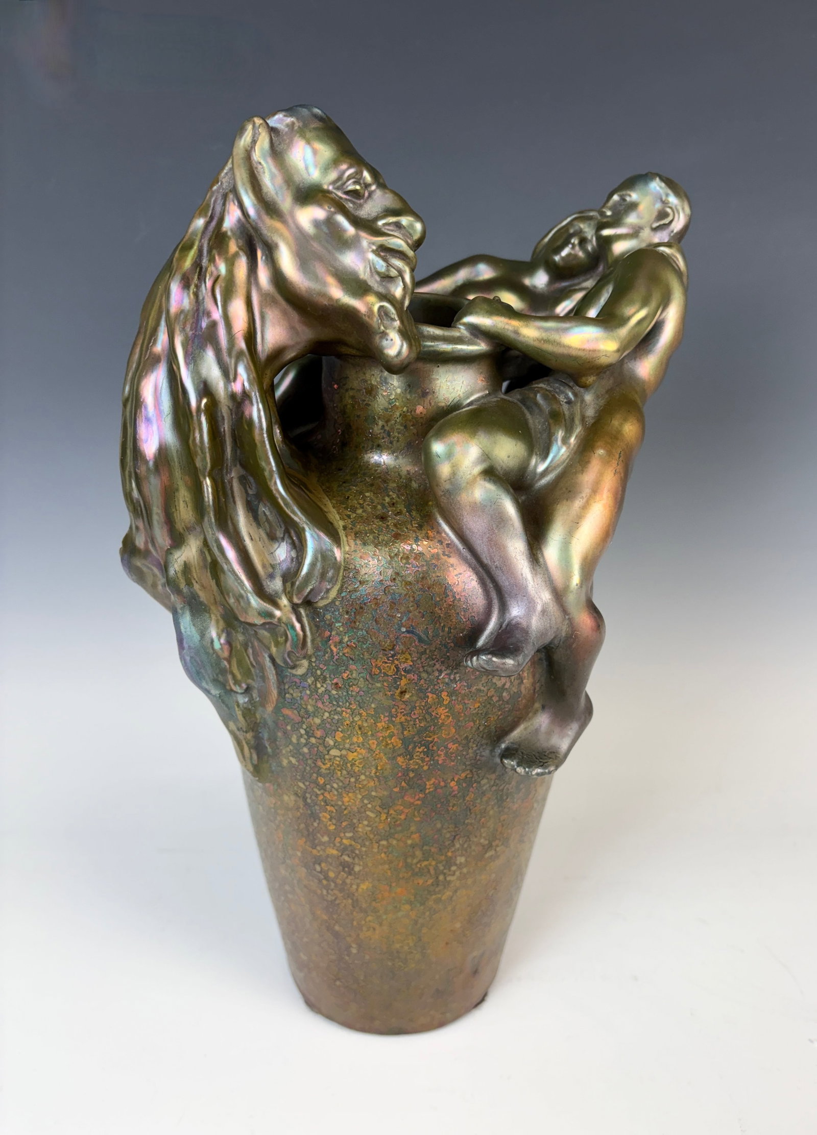 Rare Massier & Vibert Figural Ceramic Vase: Circa 1900, Clement Massier (1845-1917) and James Vibert (1872-1942), a fine and rare large earthenware vase with metallic lustre glaze, having an embracing couple and the head of Bacchus, signed "J. 