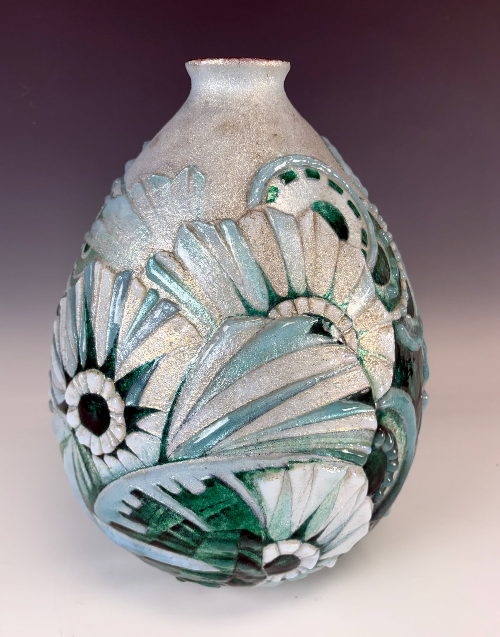 Faure Limoges Art Deco Enamel Vase: Circa 1920, gorgeous Camille Faure art deco vase with relief enamel (very challenging technique) over applied silver foil with deep emerald green, sky blue and opalescent white enamel with stylized ge