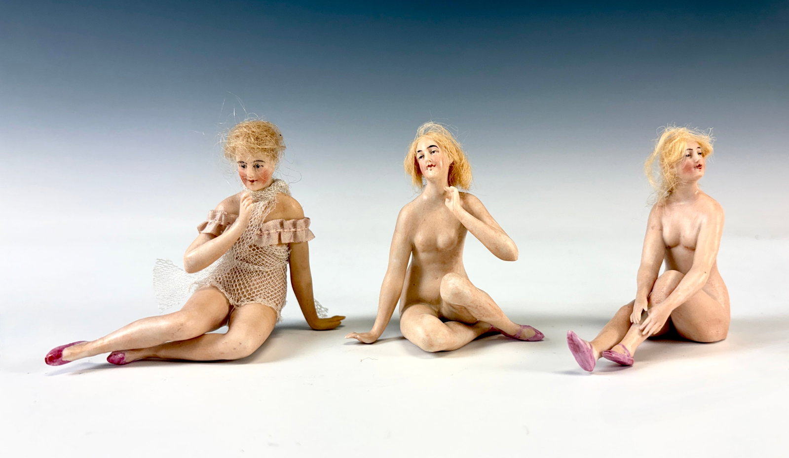 3 Antique Bisque Bathing Beauties w Mohair Wigs: Circa 1900, group of three beautiful porcelain bathing beauty figurines with mohair wigs, likely German by Galluba & Hoffman, two with no clothing, one marked #19, the third with pink mesh bathing sui