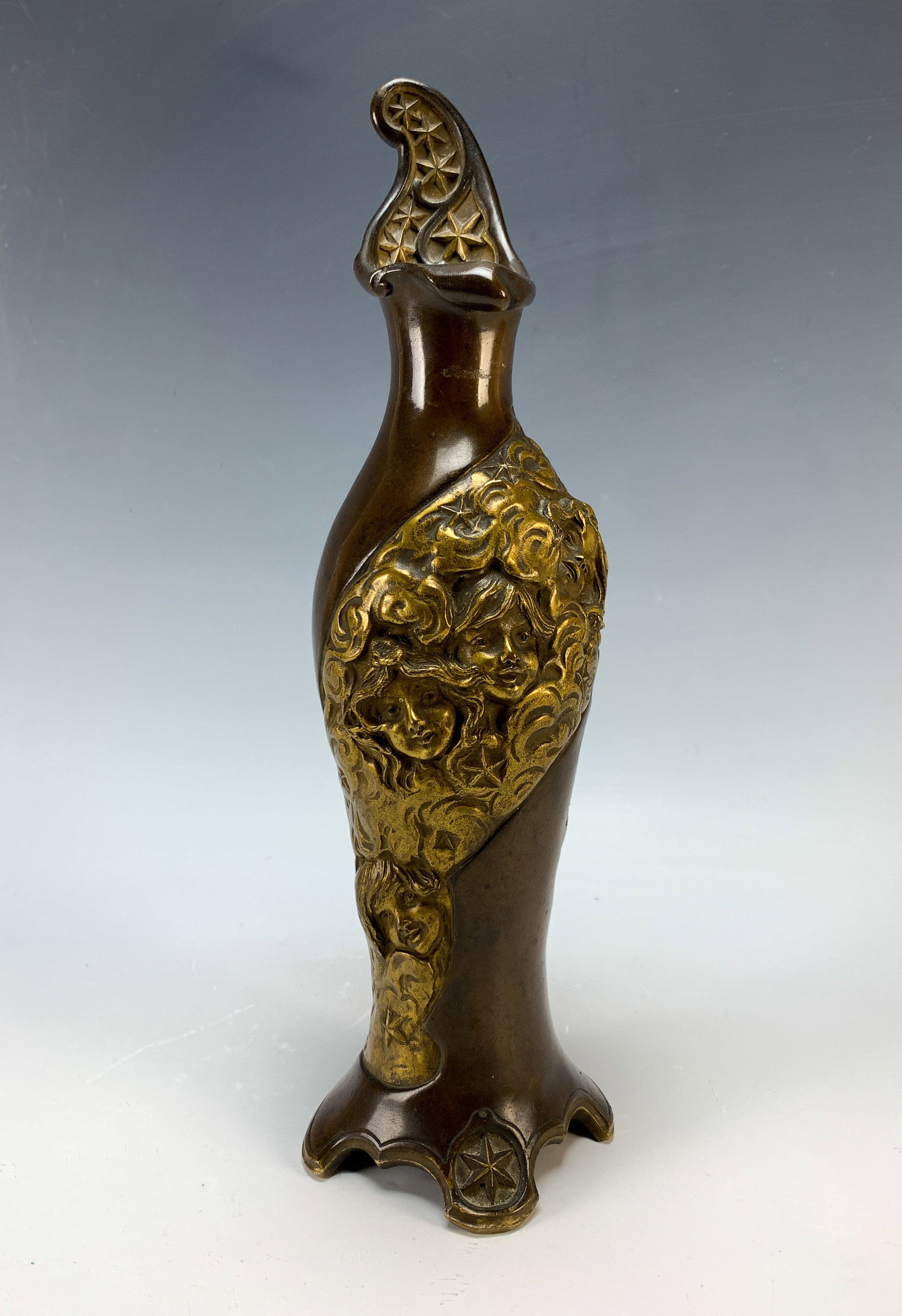 Charles Korschann Art Nouveau Bronze Vase: Circa 1900, French art nouveau bronze vase with very good brown and golden patina, decorated with faces among clouds and stars, signed "Ch. Korschann Paris" with Louchet foundry mark, 12" tall, very g