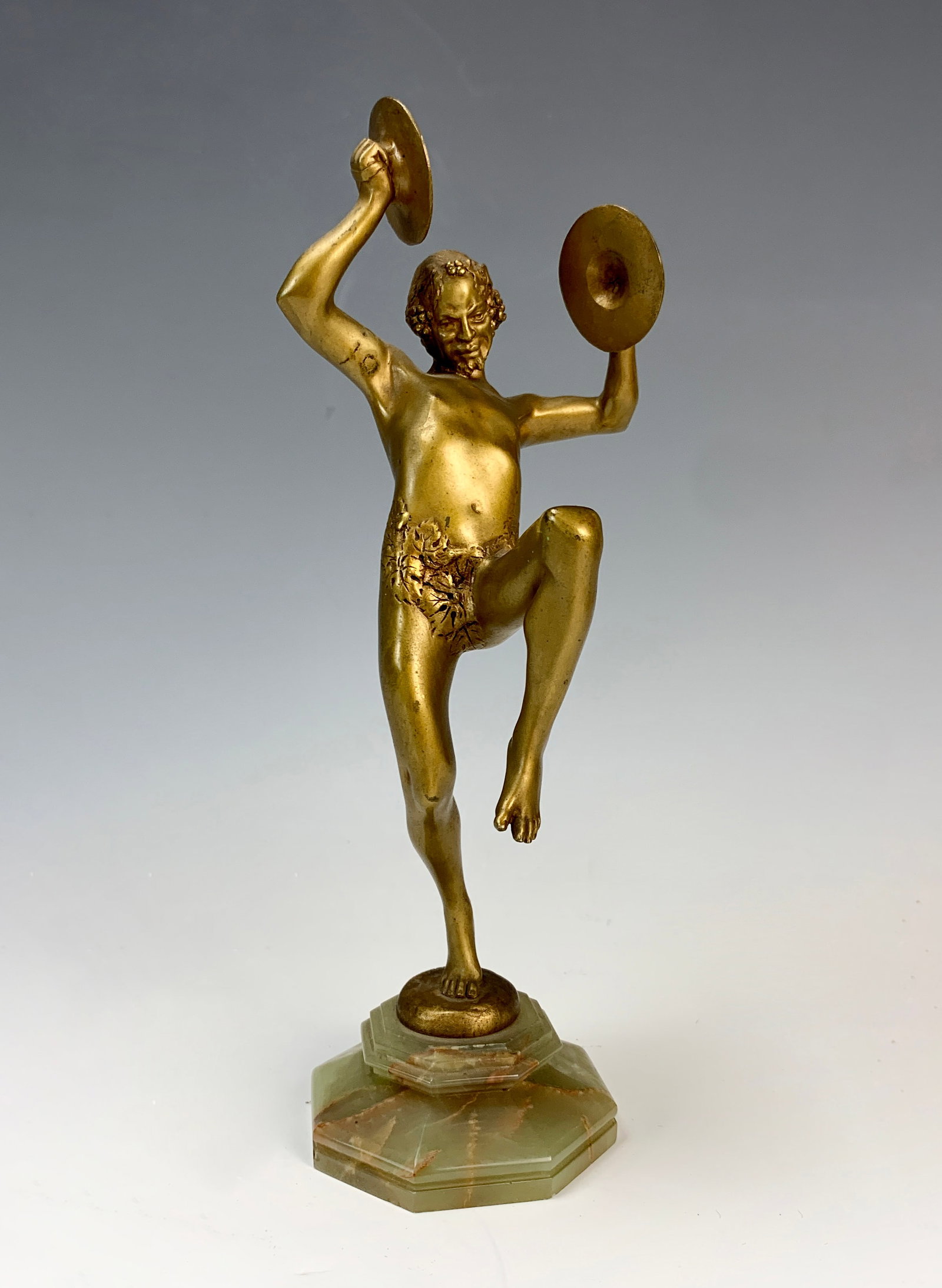 Eugene D. Piron Bronze Faun & Cymbals Sculpture: Eugene D. Piron (1875-1928) Circa 1900, Gilt bronze of a faun playing cymbals, mounted on an octagonal green onyx base and signed on the bronze "E. Piron" good condition with wear to patina commensura