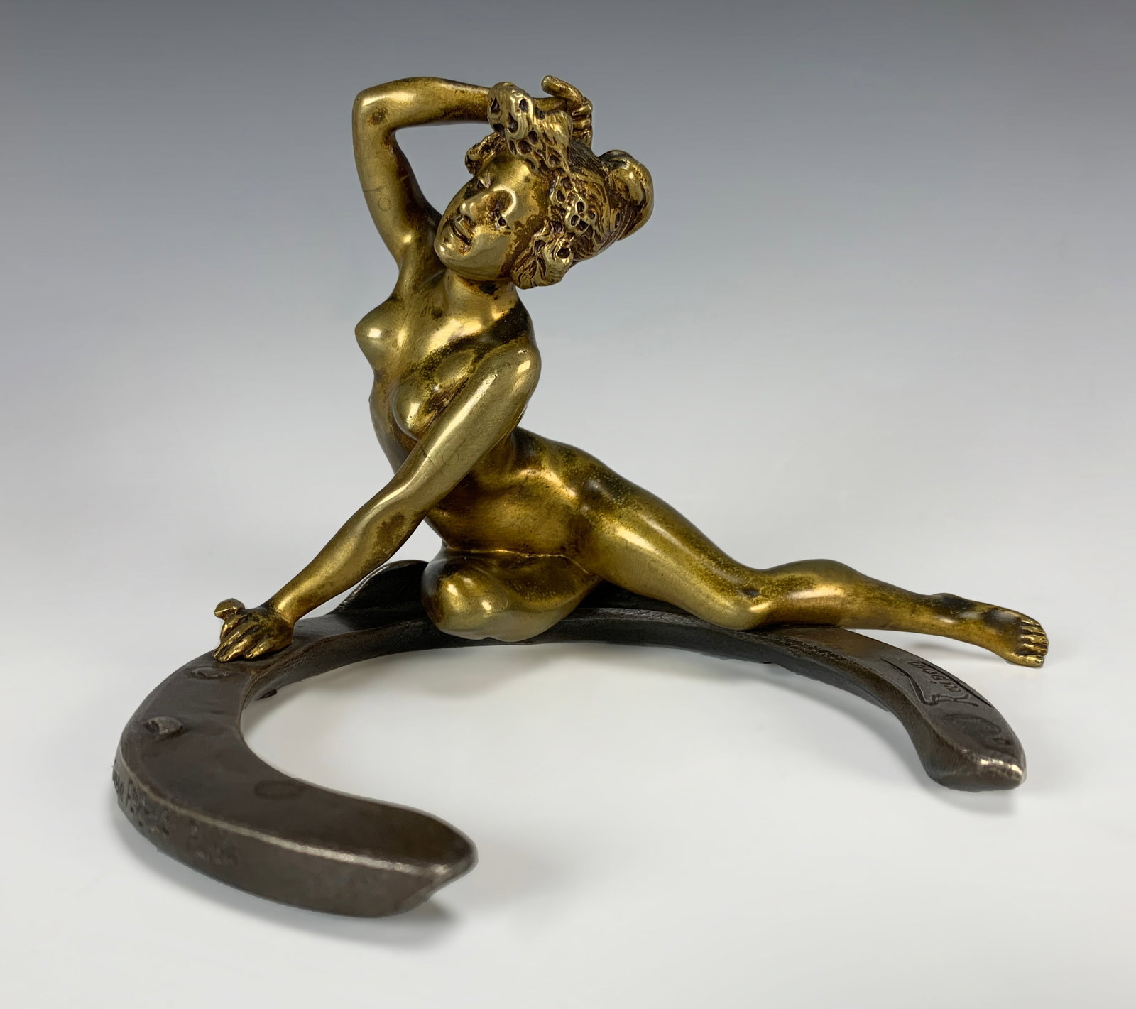 Georges Recipon Bronze Nude Sculpture w Horseshoe: Georges Recipon (1860-1920) Two tone bronze figurine having a nude lady hammering a horseshoe, signed "Recipon" with foundry seal and foundry mark "Susse F. Edt Paris", good condition with wear commen