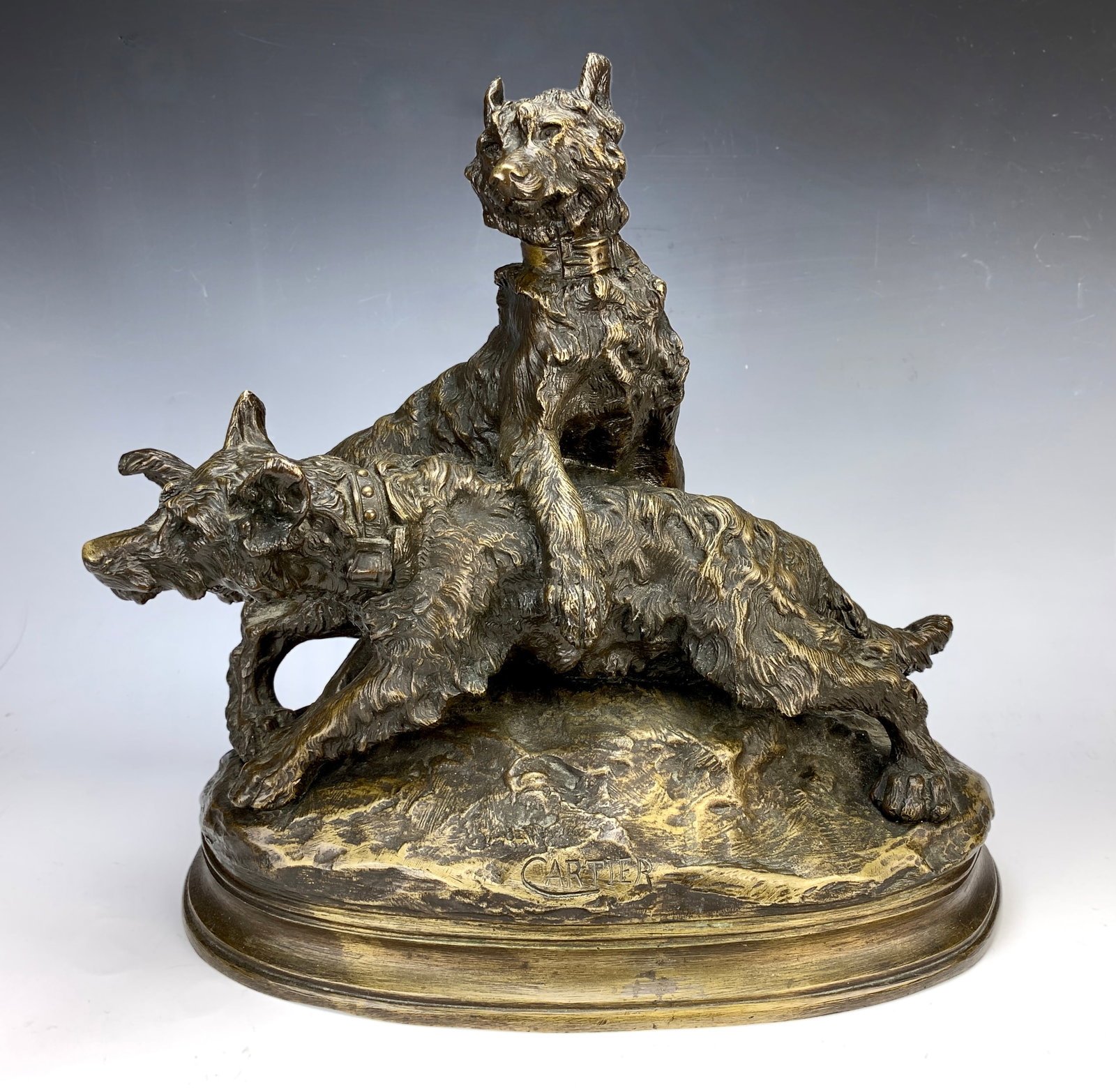 Thomas Francois Cartier Bronze Dogs Sculpture: Circa 1900, Thomas Francois Cartier (France 1879 - 1943) great large bronze depicting two dogs playing. Has great patina and detail, signed "Cartier". Very good condition, good patina.. 16" x 17" x 9"