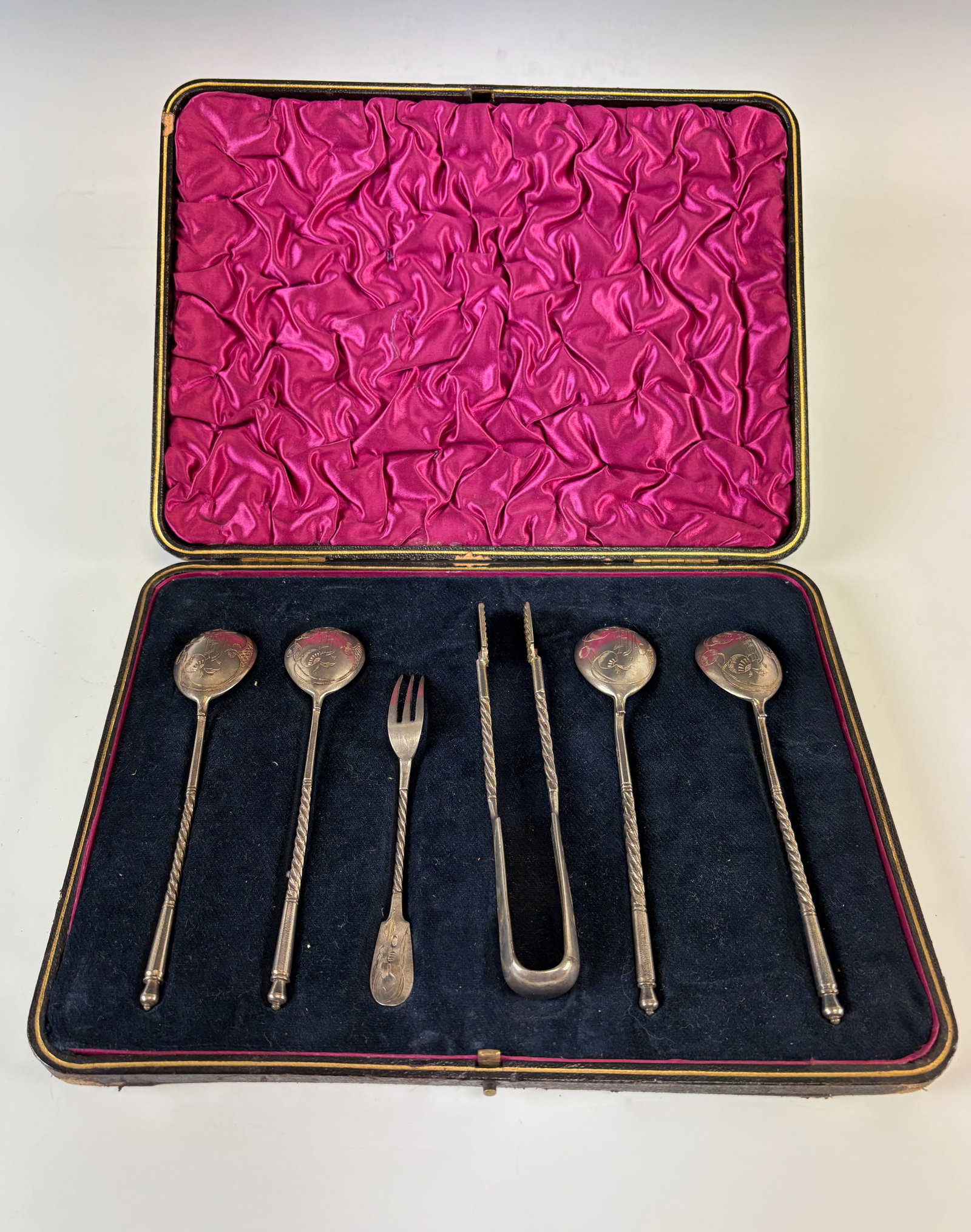 Russian 84 Silver Appetizer Set: Circa 1900, boxed set of Russian 84 silver serving pieces includes sugar tong, 4 spoons and an appetizer fork, all marked 84 Silver and hallmarked, in a black leather presentation case with red interi