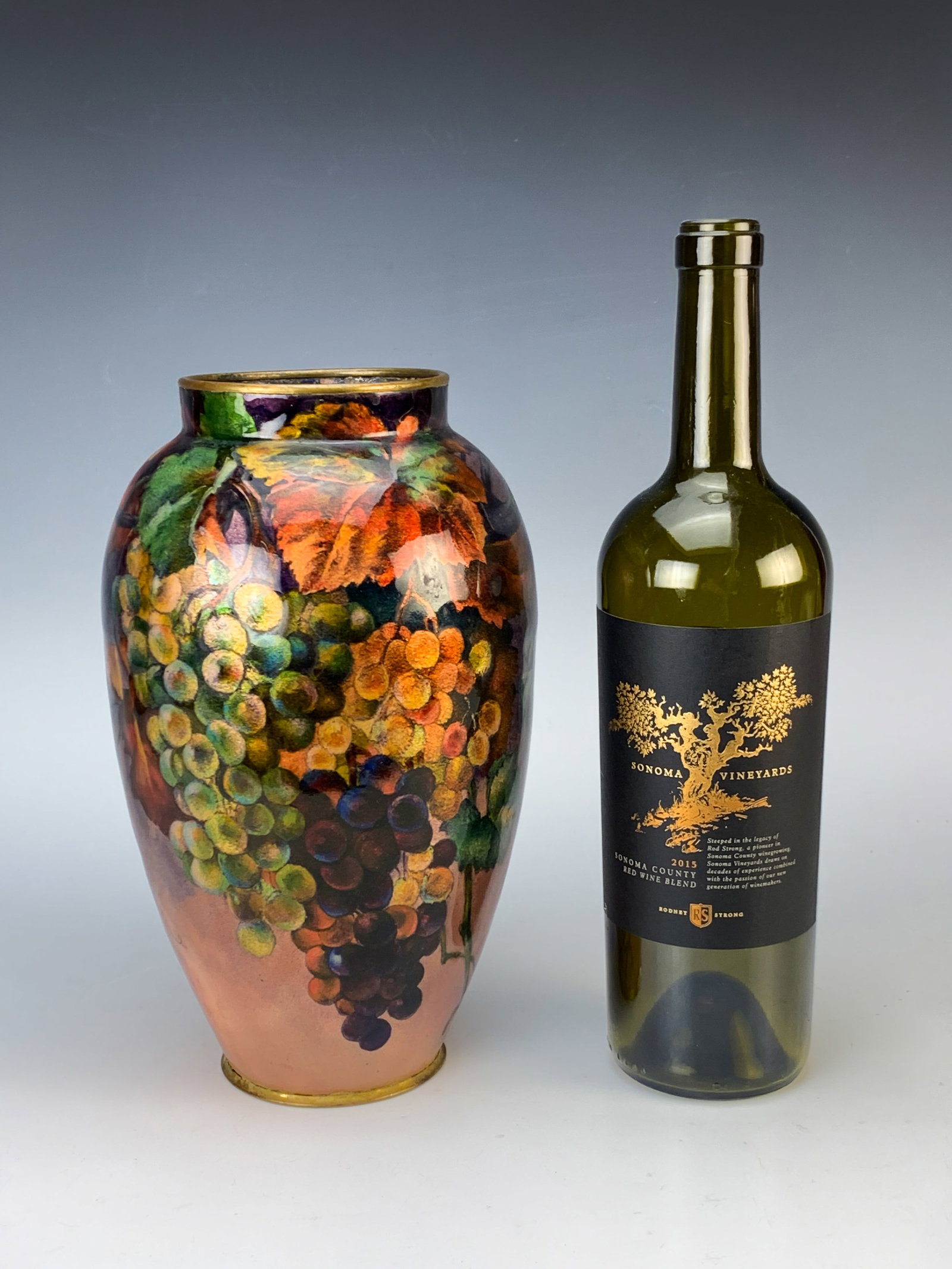 Alexandre Marty Large Limoges Enamel "Grapes" Vase: Circa 1920. Wonderful enamel on copper with grapes, vines and foliage in vibrant red, green and purple. Signed at top collar "A. Marty Limoges". Alexandre Marty worked with Faure between 1919 and 1925