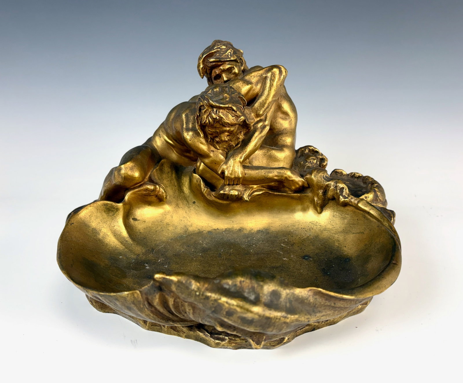 Figural Bronze Inkwell with Wrestlers sgd G Michel: Gustave Frederic Michel (France 1851-1924) A fine gilt bronze inkwell "The Wrestlers" with the two figures above a shell and a hidden ornament that is the inkwell, has inscription inside lid, signed "