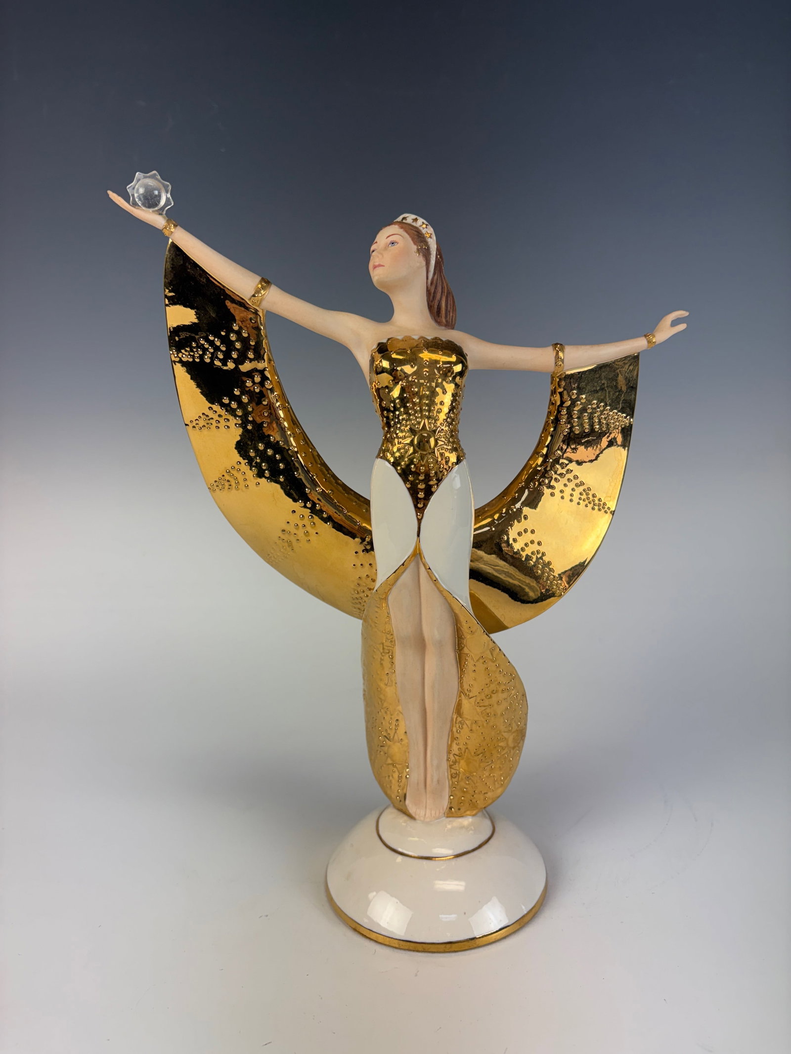 Franklin Mint Sunrise in Gold Porcelain Figurine: A beautiful Franklin Mint fine porcelain figurine depicting an elegant female figure. 11” tall × 8.5” wide × 3.5” deep. In excellent condition.