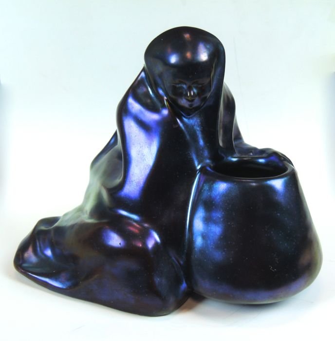 Early Zsolnay Inkwell: Early Zsolnay Inkwell Early 1900's, Zsolnay purple iridescent inkwell in form of a maiden and pot, has tower mark in circular relief, 5.25" H x 7"L x 4"D