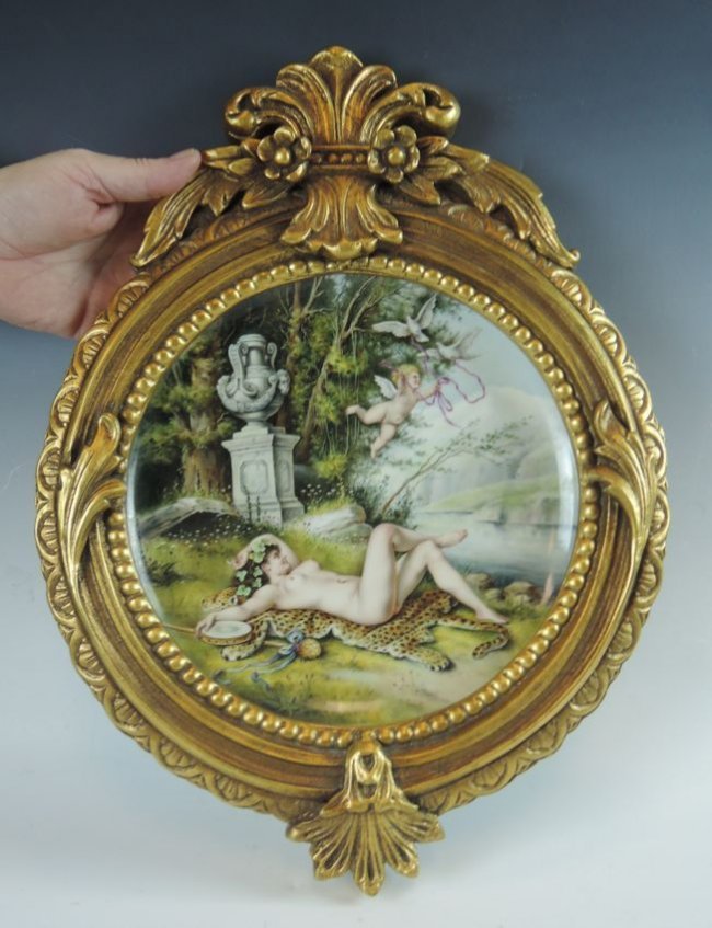 Painting on Porcelain Plaque: Painting on Porcelain Plaque A very well done painting of a nude on a leopard skin with cherub and white doves on round porcelain plaque with ornate gilt wood frame. KPM quality, has impressed "PLM" o
