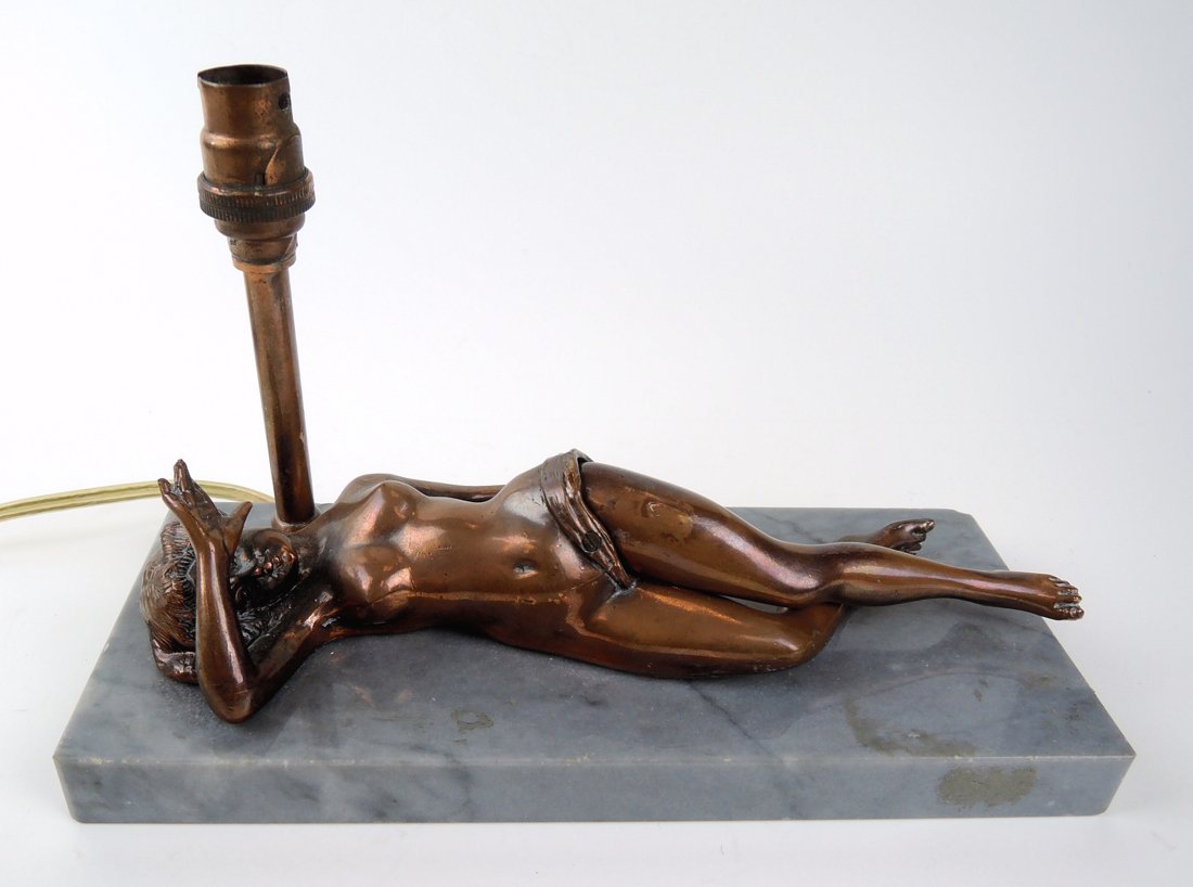 Bronze Erotic Cigar Cutter Nude with Hinged Legs: Circa 1880, figural cigar cutter, the bronze reclining nude having hinged legs and a cigar cutter hidden in her crotch which is revealed upon opening the top leg, mounted onto a marble plinth, has a l