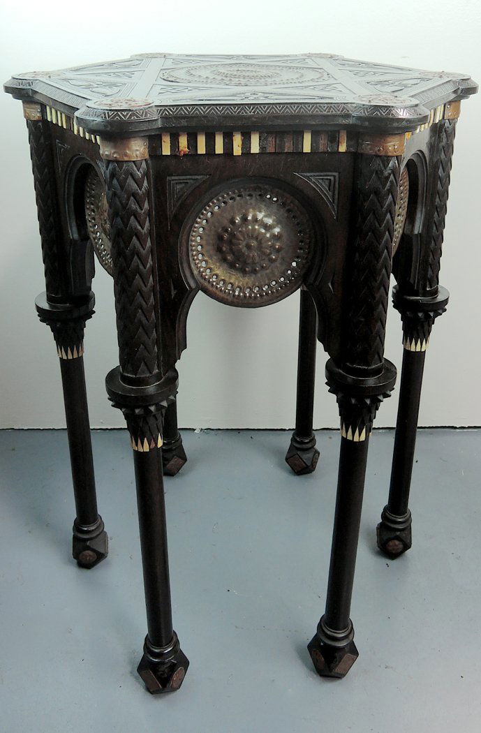 Repousse Copper Mounted Table Att. Carlo Bugatti: Late 19th C, Italian,attributed to Carlo Bugatti, hexagonal carved stand in the Moorish taste with applied round repousse copper discs, the top with a large central copper roundel mount and carved rel